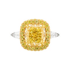 GIA Certified 4.50ct Fancy Light Yellow VVS1 Cushion Cut Three-Stone Ring