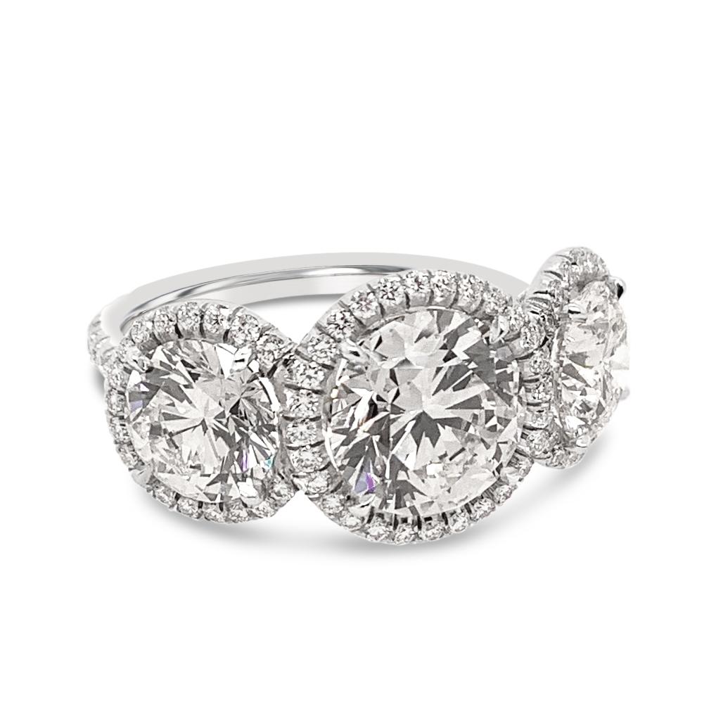 Brilliant Cut GIA Certified 4.51 Carat 'total weight' 3-Stone Diamond Halo Ring in Platinum