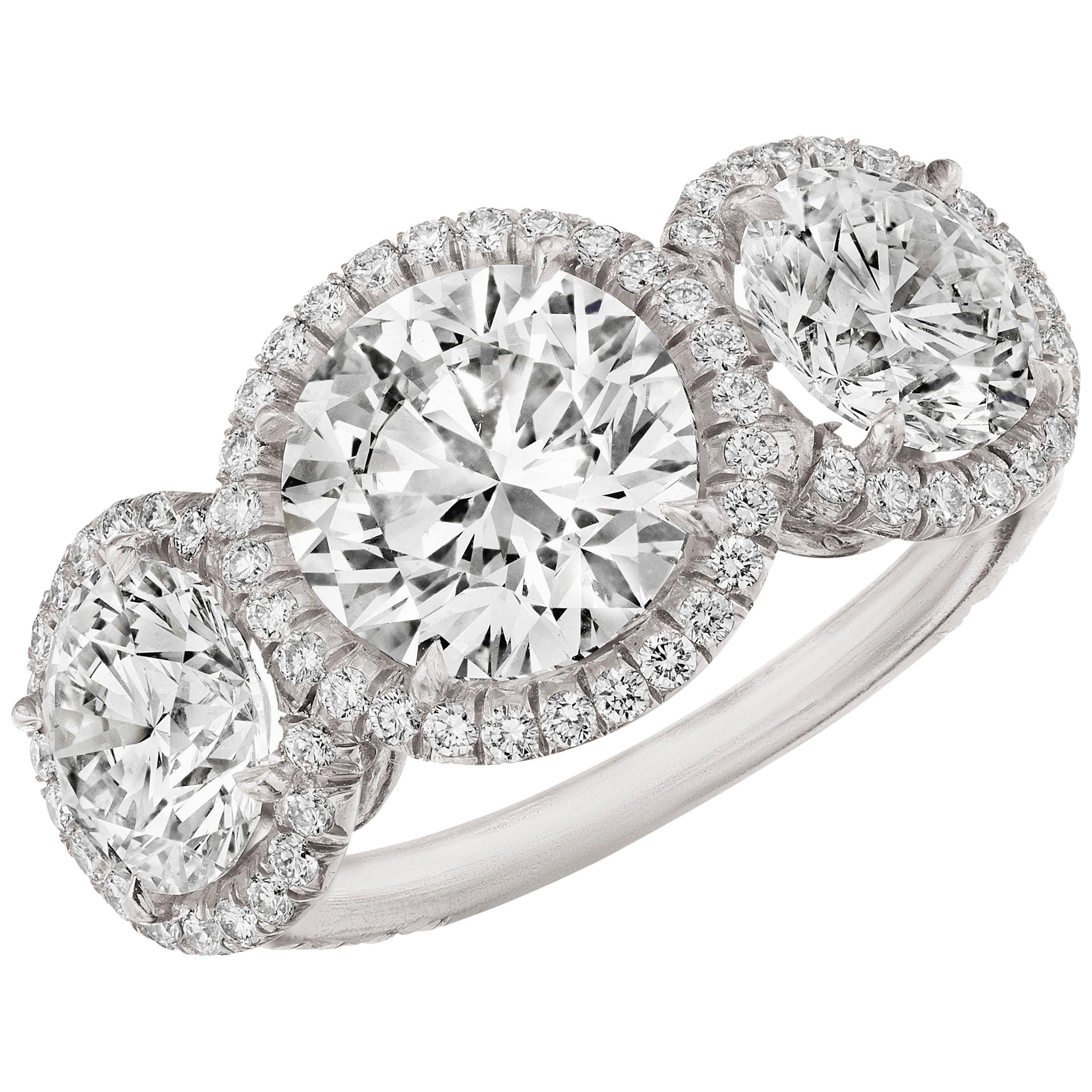 GIA Certified 4.51 Carat 'total weight' 3-Stone Diamond Halo Ring in Platinum