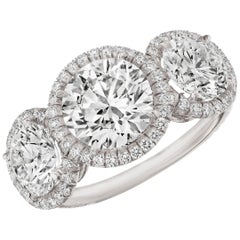 GIA Certified 4.51 Carat 'total weight' 3-Stone Diamond Halo Ring in Platinum