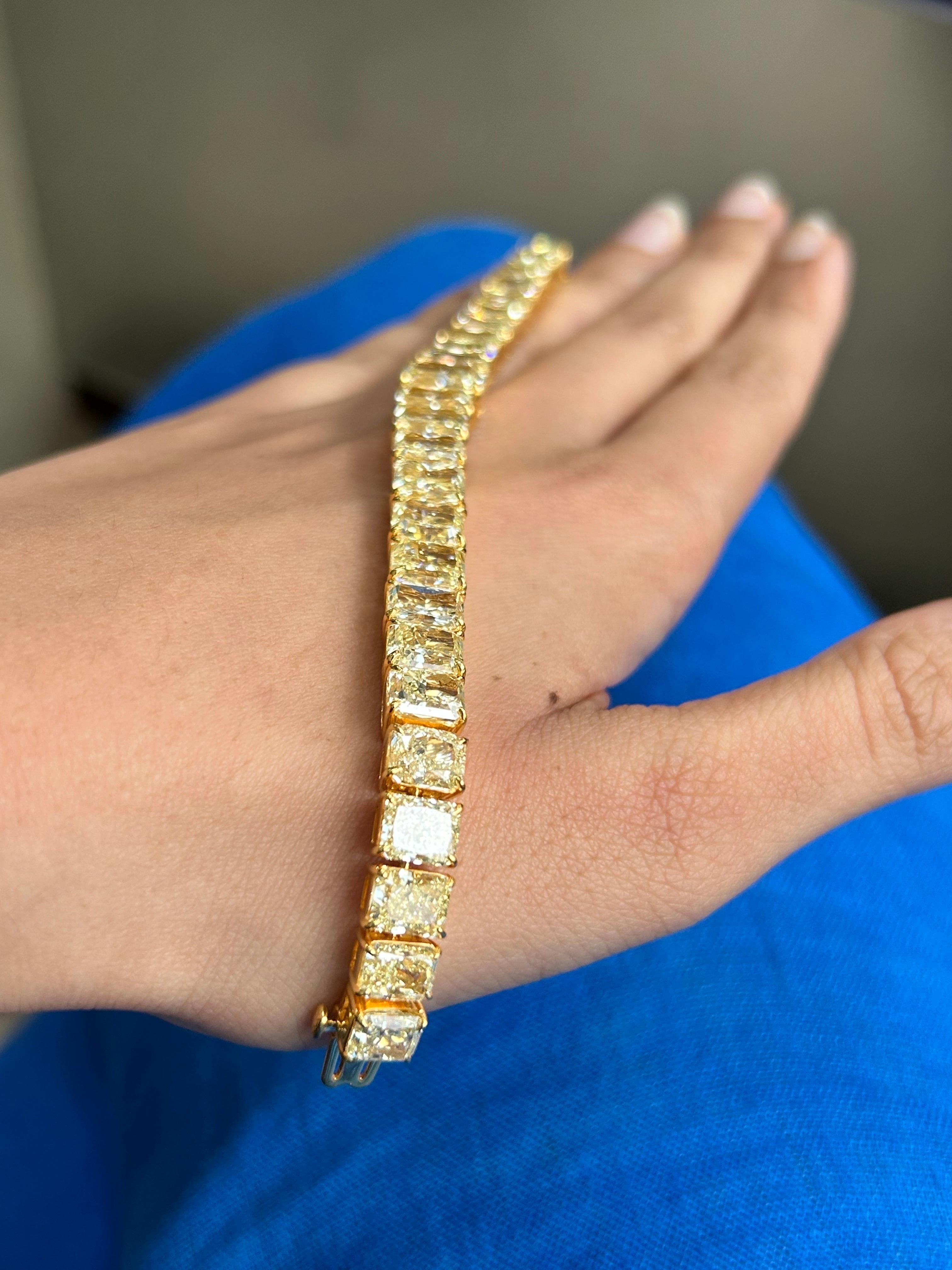 A one of a kind radiant cut Yellow Diamond bracelet, set in solid 18K Yellow Gold. There are a total of 29 pieces in this bracelet, all GIA certified - WX/YZ - fancy light yellow color, IF-VS1 clarity. The stones range from 1 to 3.73 carats each. 12