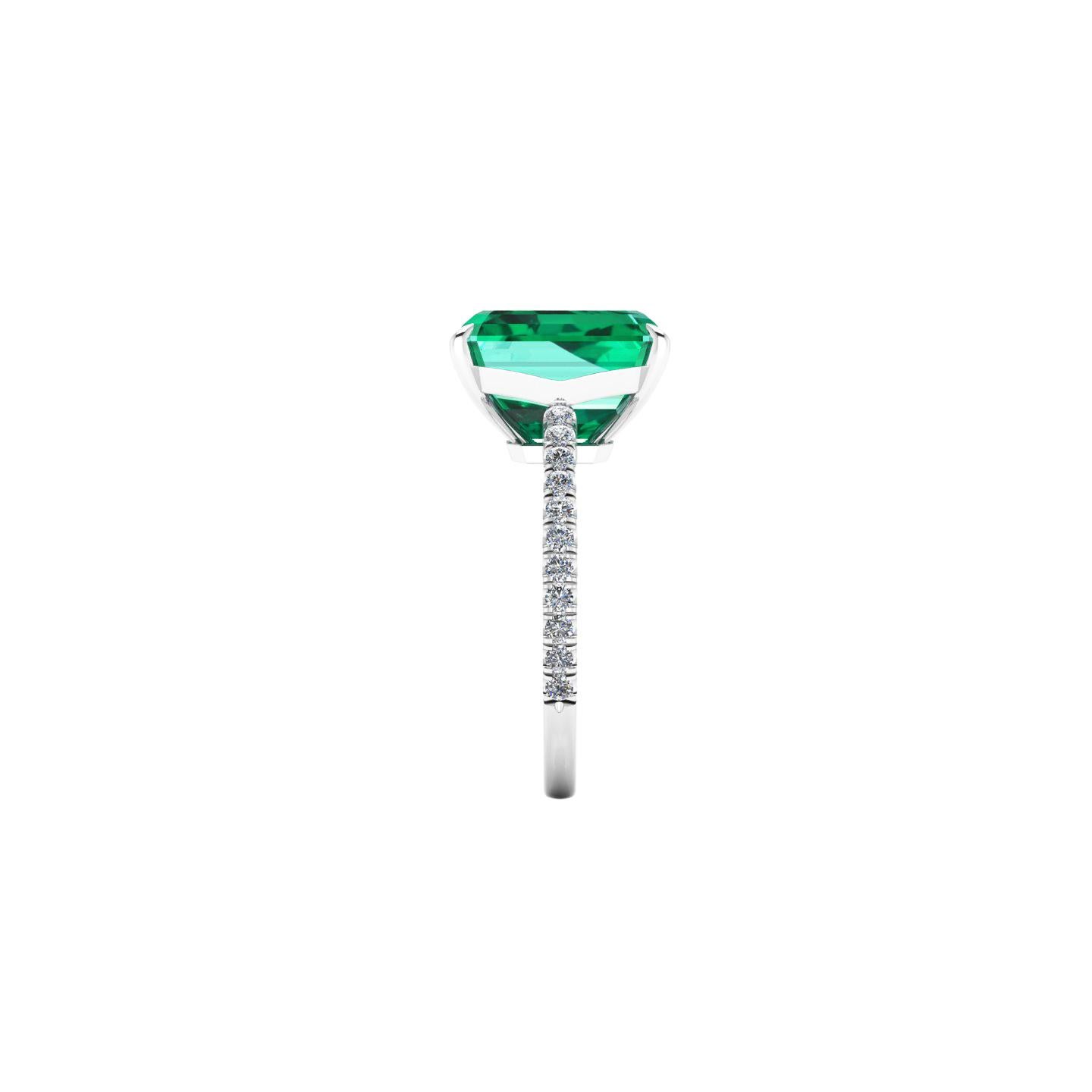 GIA Certified 4.53 carat Emerald, very high quality color,  embellished by a pave' of bright diamonds of approximately  total carat weight of 0.32 carat, set in a hand crafted Platinum 950 ring, manufactured with the best Italian