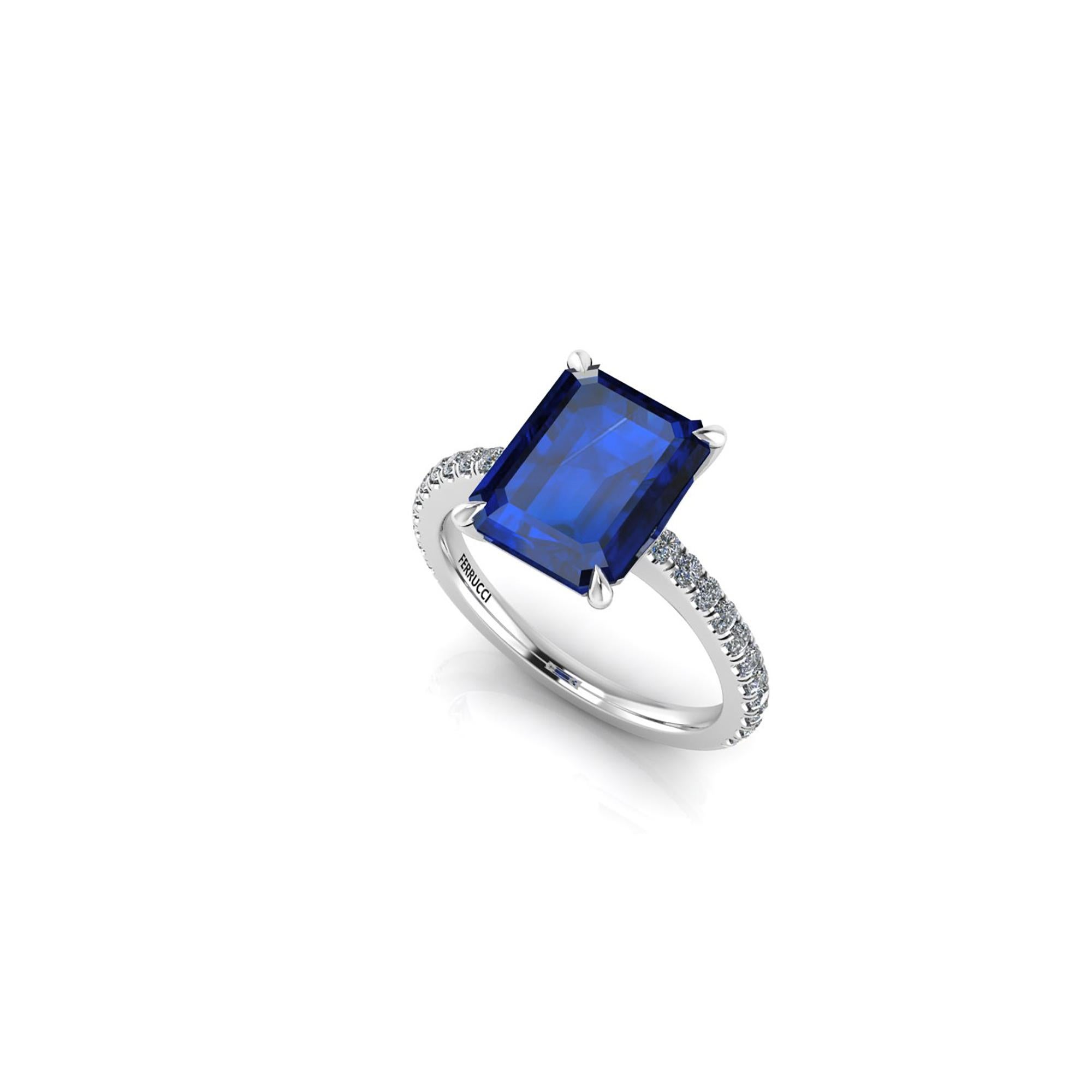 GIA Certified 4.53 carat Sri Lanka emerald cut Sapphire, very high quality color,  embellished by a pave' of bright diamonds of approximately  total carat weight of 0.32 carat, set in a hand crafted Platinum 950 ring, manufactured with the best