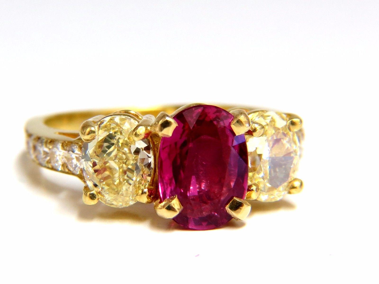 GIA Certified Ruby & Yellow Diamonds Ring

2.07ct. GIA Oval Red Ruby

Report: 2173630687

(VS) Clean Clarity & Transparent.

9.08 X 6.68 X 3.68mm

GIA: No Heat

1.96ct Side natural fancy yellow diamonds

Oval shaped, full cut brilliant.

Vs-2