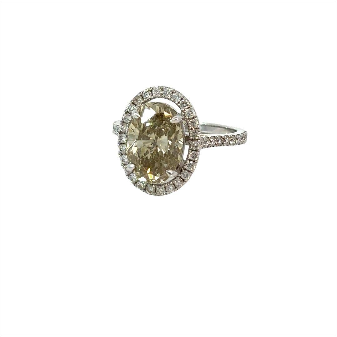 GIA Certified 4.56 Carat Brownish Greenish Yellow Oval Brilliant Diamond Ring For Sale 1