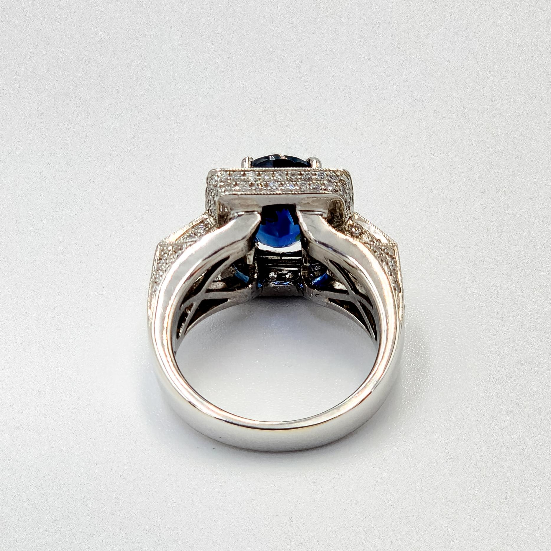 Oval Cut GIA Certified 4.57 Carat Natural Blue Sapphire Ring with Diamonds in 18k Gold For Sale