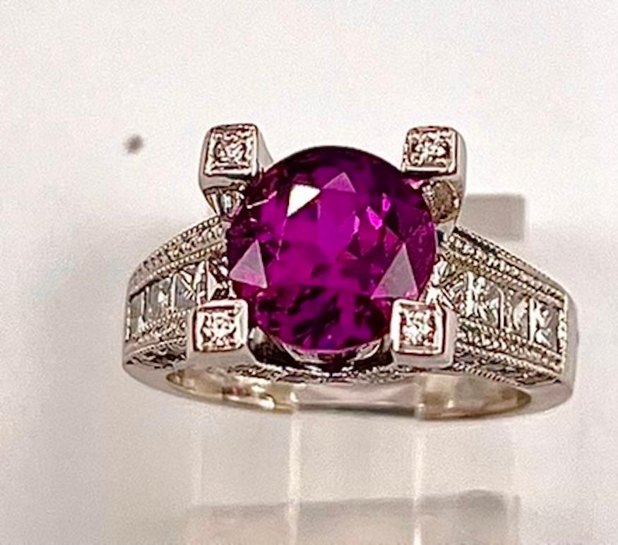 This exquisite Purple Pink Sapphire will draw you in immediately.  The depth, intensity and saturation of color is amazing. This sapphire is also incredibly clean to the naked eye and microscopically.  Being cut as a Round Modified Brilliant in