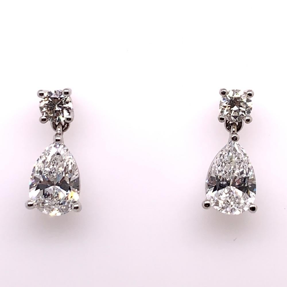 Modern GIA Certified 4.65 Carat Matching Pear Shape E-F VS2 Natural Diamond Earrings For Sale