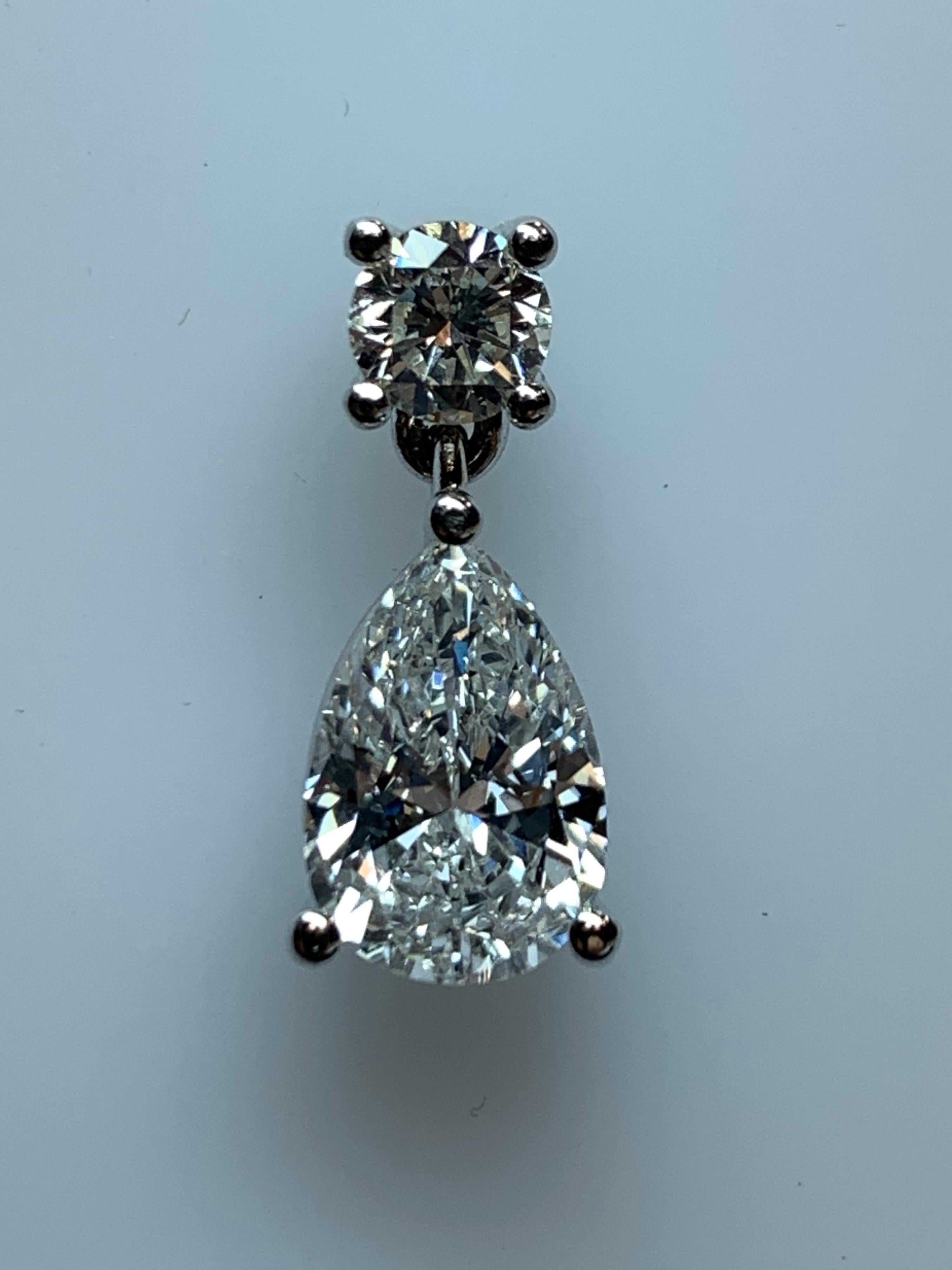 Women's GIA Certified 4.65 Carat Matching Pear Shape E-F VS2 Natural Diamond Earrings For Sale