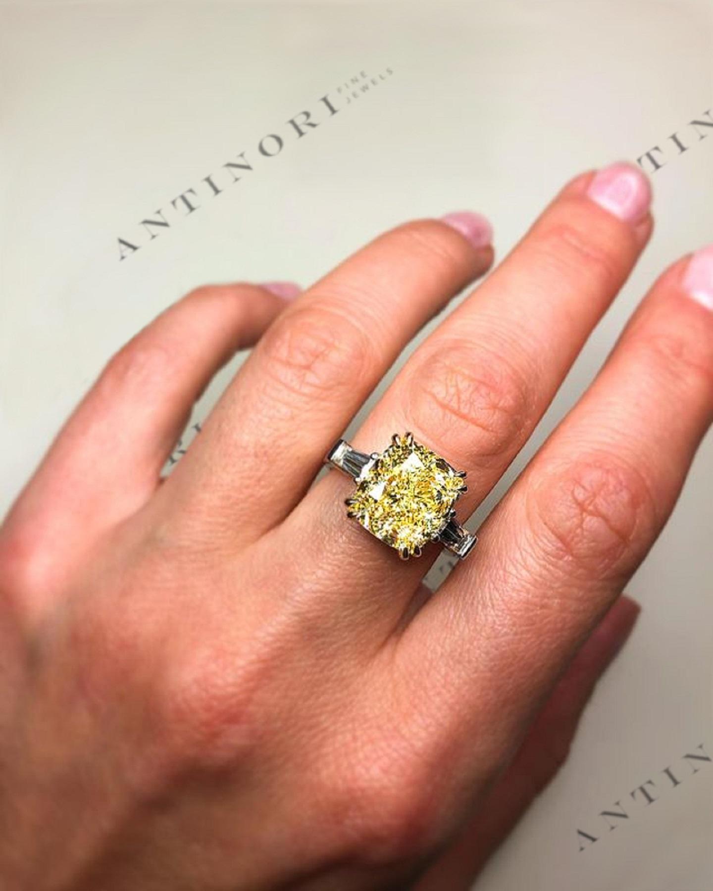 What a gorgeous diamond!! The main stone looks like a 5 carat diamond is long 9.56 mm so it has the proportions of a much bigger stone. 

Furthermore this fancy yellow diamond has the strongest color saturation so it actually looks more like a fancy