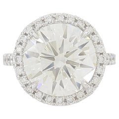 Anello di fidanzamento in platino aureolato con diamante rotondo Brilliante da 4.73 carati certificato GIA