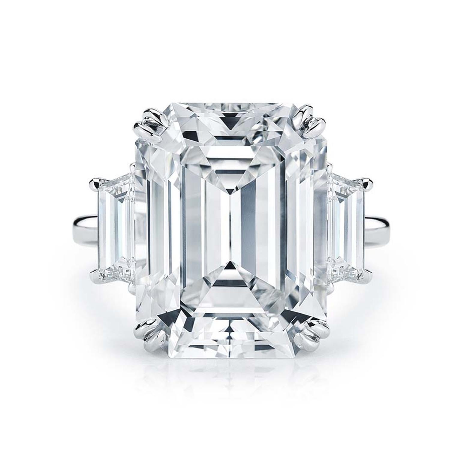GIA Certified 4 Carat Three Stone Emerald Cut Trapezoid White Gold Ring 

the main stone weights 4 side diamond approx. 0.80 carat together