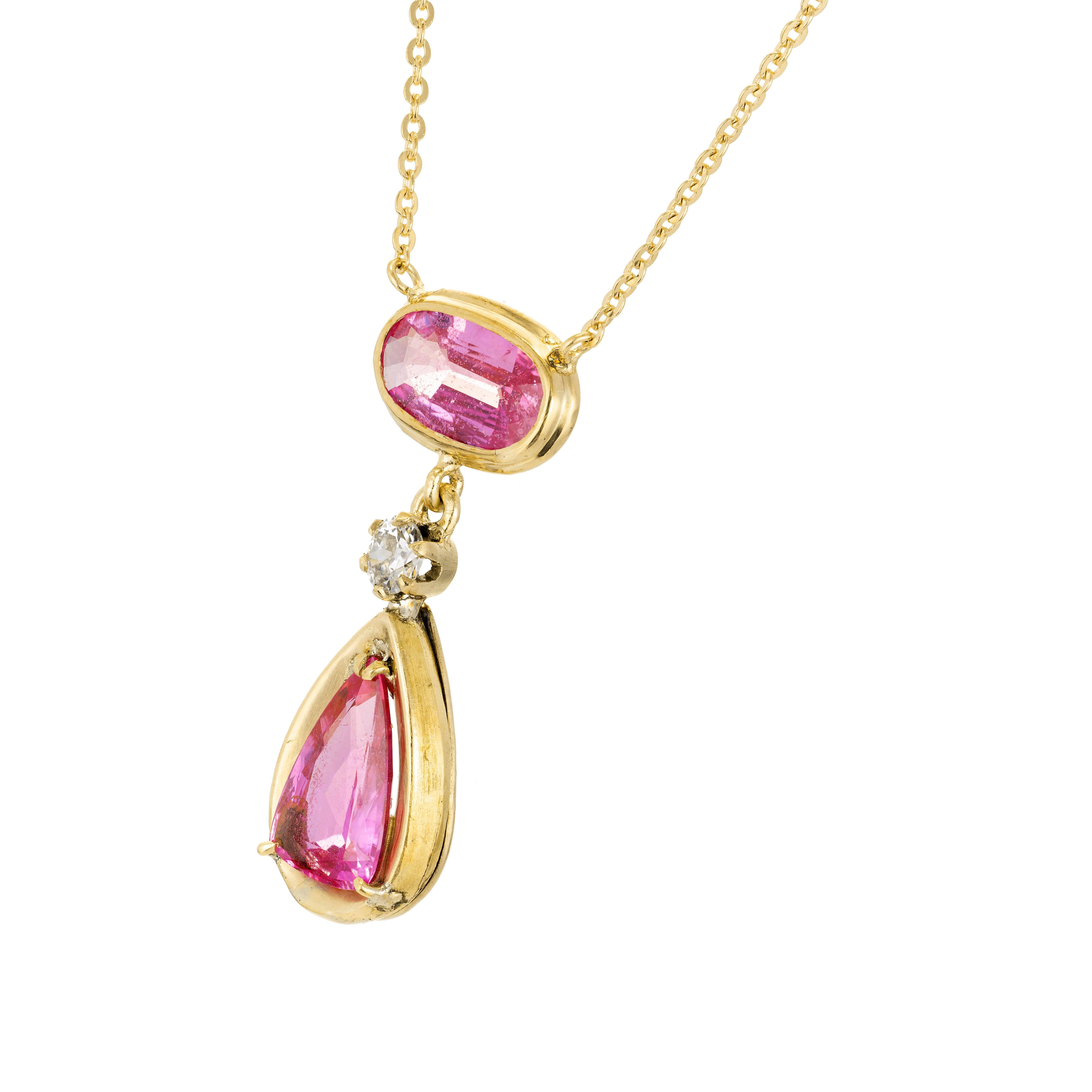 Bright pink oval and pear Sapphire, diamond pendant necklace. circa 1920 to 1930 with natural color and simple heat only. 14k rose gold. Chain may be later.

1 oval pink Sapphire, approx. total weight 2.25cts, SI, 9.12 x 4.98 x 2.60mm, natural color
