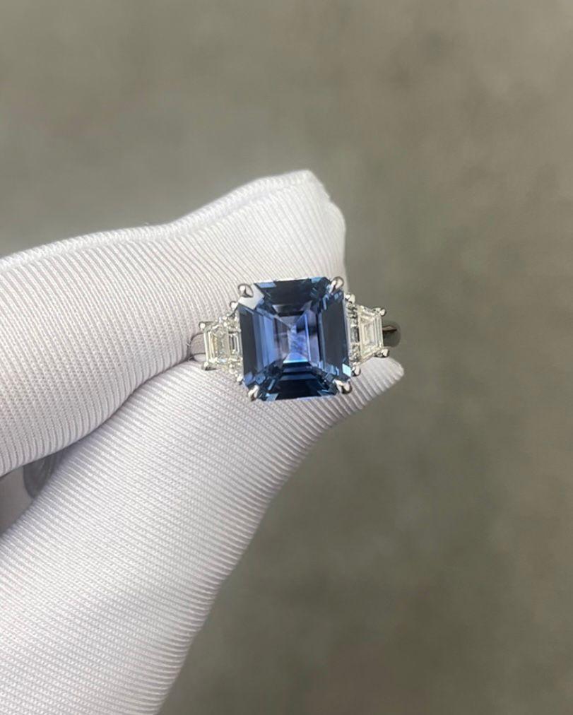 GIA Certified Emerald Cut Ceylon Sapphire weighing 4.89 carats
Measuring (10.57x9.44x5.11) mm
Diamonds weighing .87 carats
Set in platinum Ring
