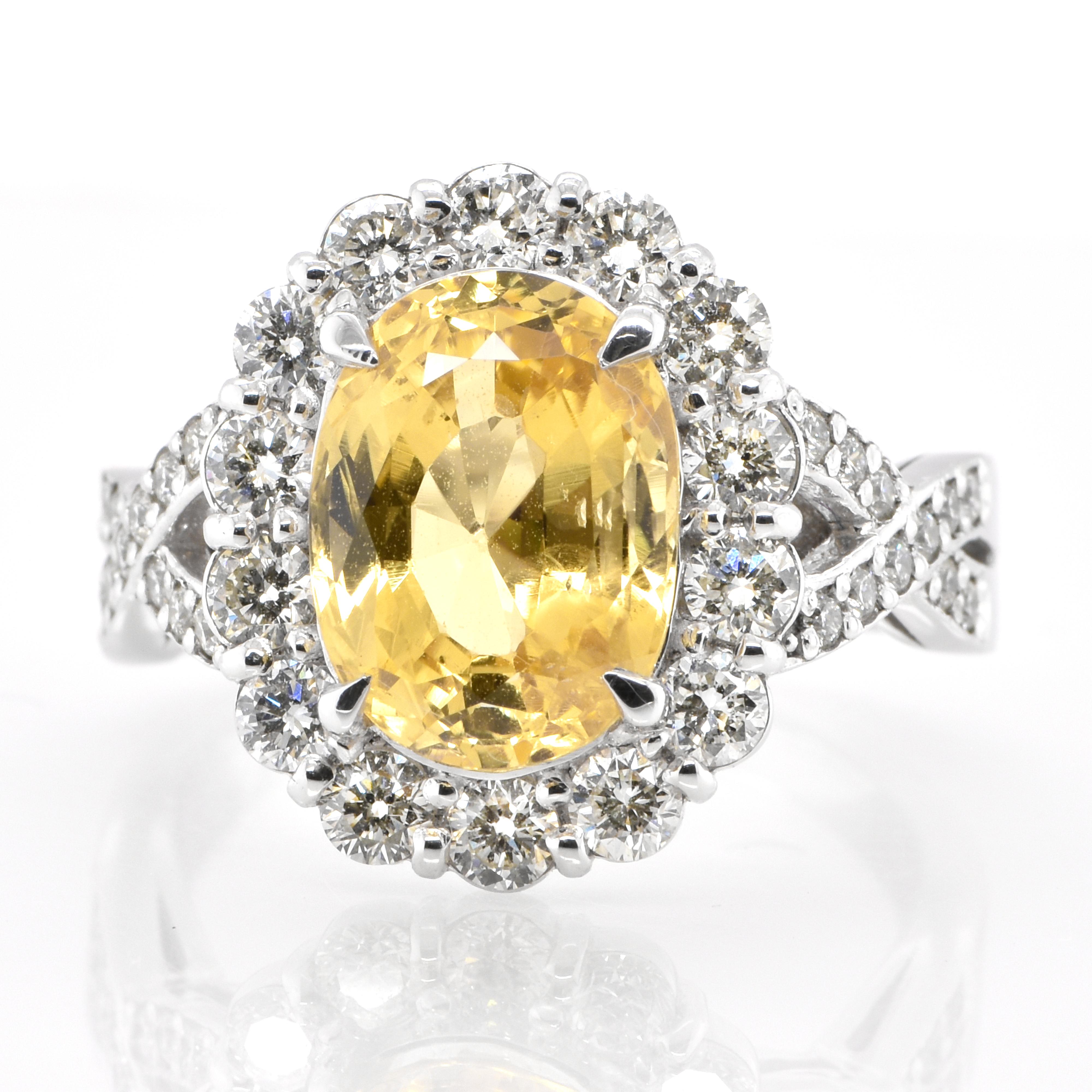 A beautiful ring featuring GIA Certified 4.90 Carat Natural, Yellow Sapphire and 1.17 Carats Diamond Accents set in Platinum. Sapphires have extraordinary durability - they excel in hardness as well as toughness and durability making them very