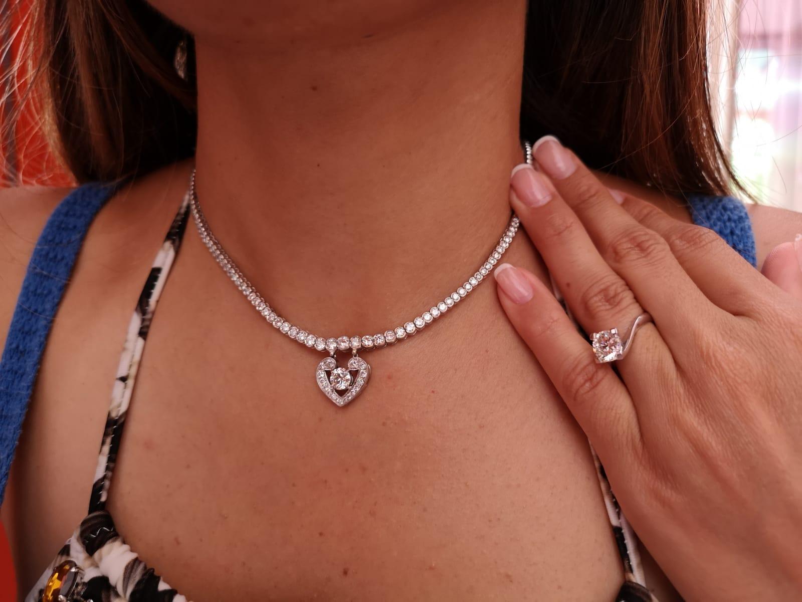 This amazing necklace has been made in Italy by our expert artisans. The main stone is GIA certified as you can see from the pictures is 100% eye clean and very bright.

The diamonds in the tennis are all vvs and vs clarity f/g color.

The mounting