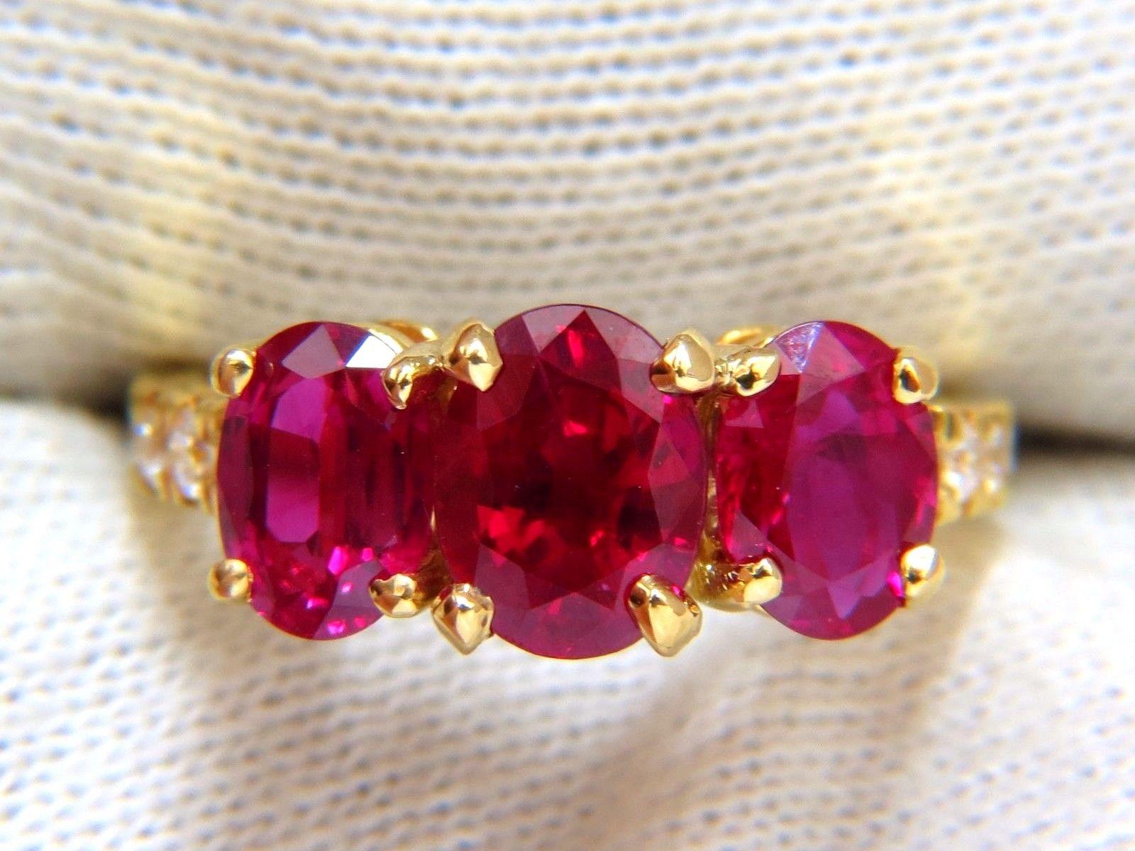 GIA Certified Ruby & Diamonds ring.

Classic Three's

All Rubies are certified & origin.

2.11ct. Oval Bright Red Ruby

Report: 2173413005

(VS) Clean Clarity & Transparent.

7.97 X 6.16 X 5mm

GIA: Heat 

Side (2) Rubies:

1.05 & 1.08ct. Oval