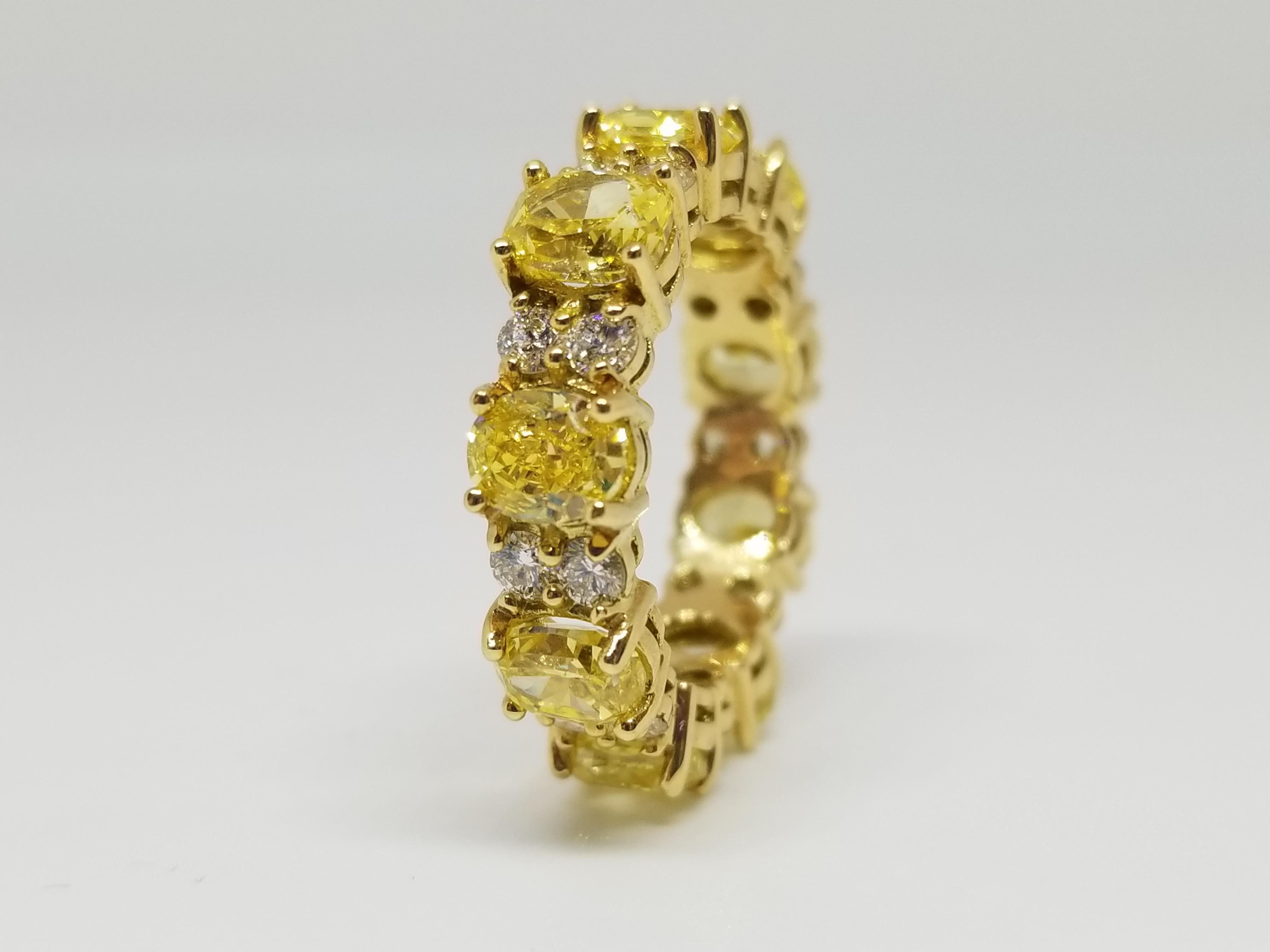 GIA Certified 4.98 Carat Natural Fancy Vivid Yellow Oval Diamond Eternity Band In New Condition In Great Neck, NY