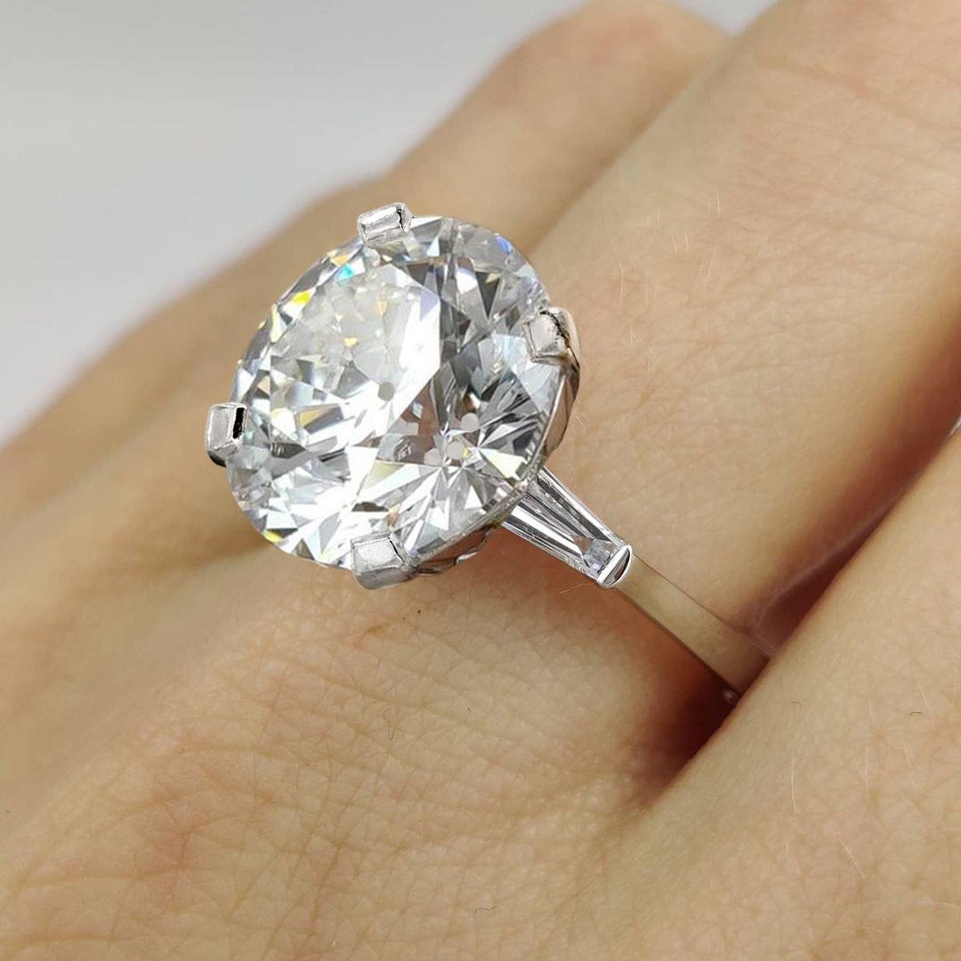 Presenting an impressive ring featuring a GIA Certified 5 carat Circular Brilliant Old Old European cut diamond. 

This exquisite 5-carat Circular Brilliant diamond showcases a J color grade, highlighting its near-colorless brilliance, and a SI2