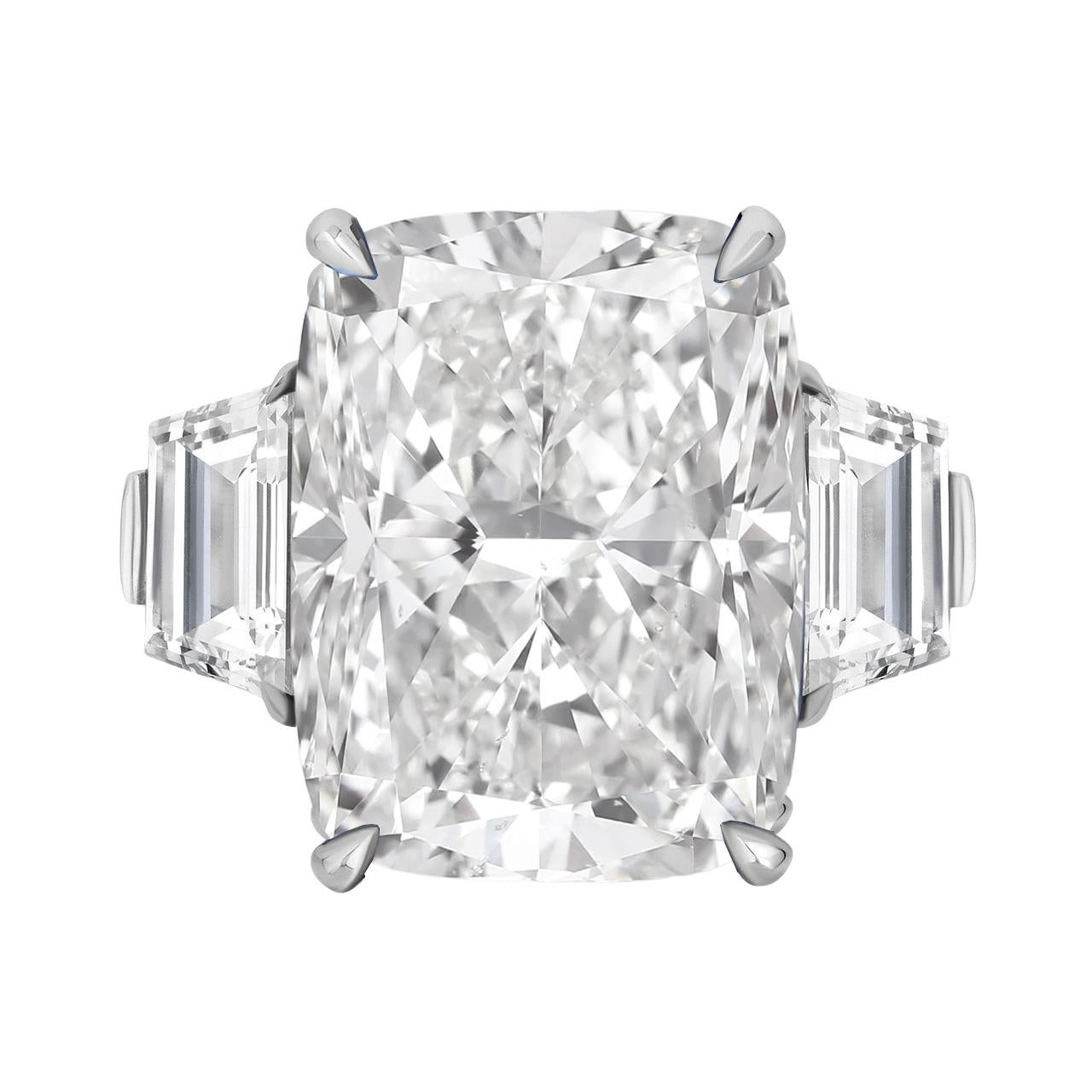 This magnificent engagement ring features a breathtaking GIA certified 5 carat cushion-cut diamond as its centerpiece. The diamond is of exceptional quality, with a color grade of D, ensuring a very slight hint of color that is virtually