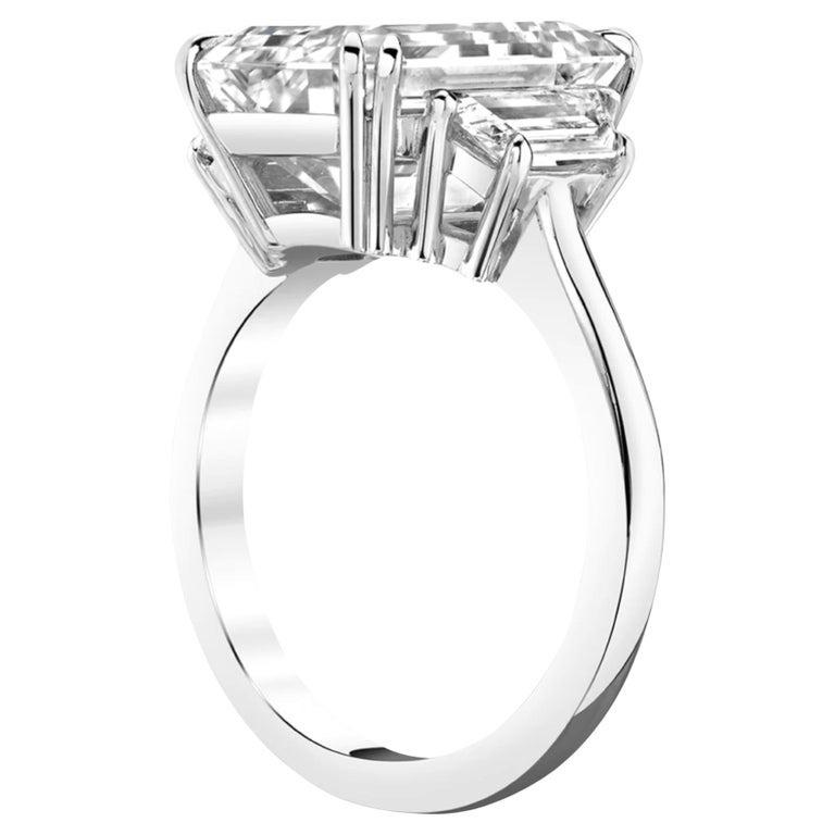 Showcasing a 5 carat emerald-cut diamond of exceptional G color and VVS2 clarity (GIA Certified), this elegant engagement ring is crafted in 18K white gold. The center stone’s clean lines and radiant fire are complemented by a pavé-set band of round