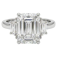 GIA Certified 5 Carat Emerald Cut Diamond and Emerald Cut Three Stone Ring