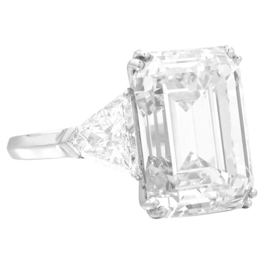 5 carats. Graded as F in color and VS2 in clarity, this diamond showcases remarkable qualities, including , excellent polish, and excellent symmetry, with no fluorescence. 

Set in luxurious platinum, the ring is a size 6, providing both elegance
