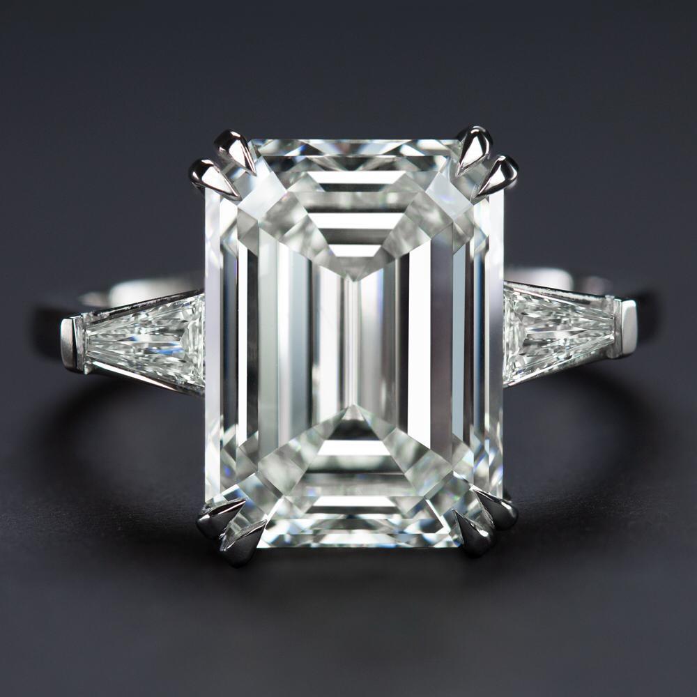 Contemporary GIA Certified 5 Carat Emerald Cut Diamond Platinum Ring with Tapered Baguette For Sale