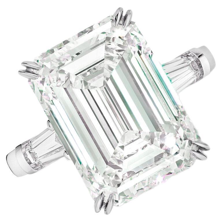 This elegant ring showcases a GIA certified 5.11 carat emerald cut diamond, accented by tapered baguette side stones.

The ring features a diamond with an F color grade truly colorless offering a brilliant sparkle that maximizes the reflection of