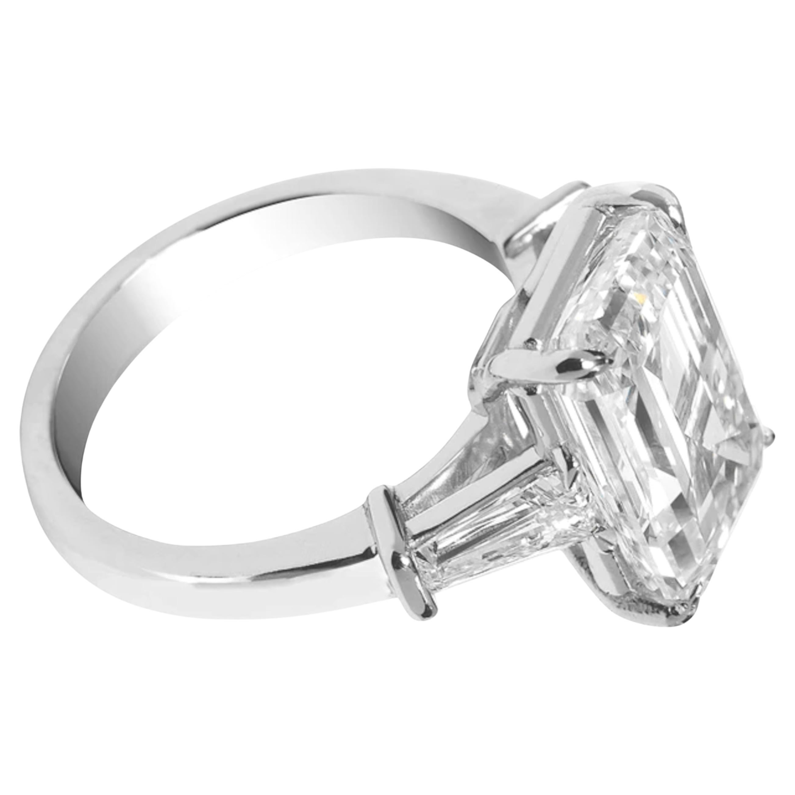This exquisite ring showcases a GIA-certified 5.11 carat emerald-cut diamond, elegantly set in 18K white gold.

The diamond features an impressive F color grade, offering exceptional whiteness and brilliance.
With a VVS2 clarity grade, it is