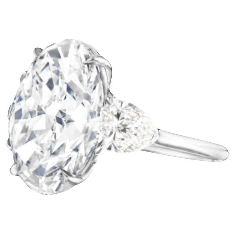 This stunning ring showcases a magnificent 5.22 Carat Oval Cut diamond as its centerpiece, GIA certified to reflect its exceptional quality and timeless elegance.

Expertly crafted in 18K white gold, the central diamond is flanked by two gracefully