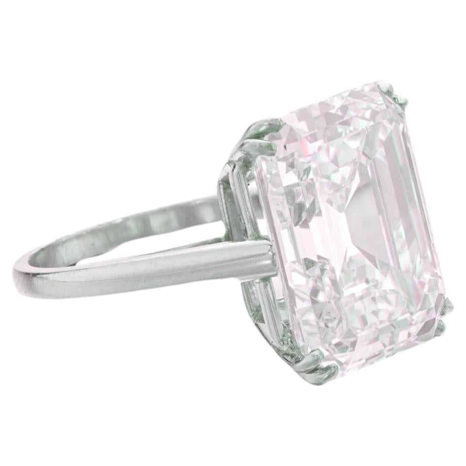 GIA Certified 10 Carat Round Brilliant Cut Diamond Ring 

the main stone is an investment grade diamond 
H Color
VVS2 Clarity
Excellent Cut 

consider the diamond is huge and  clean the stone is white faced and the closeup of the diamond shows NO