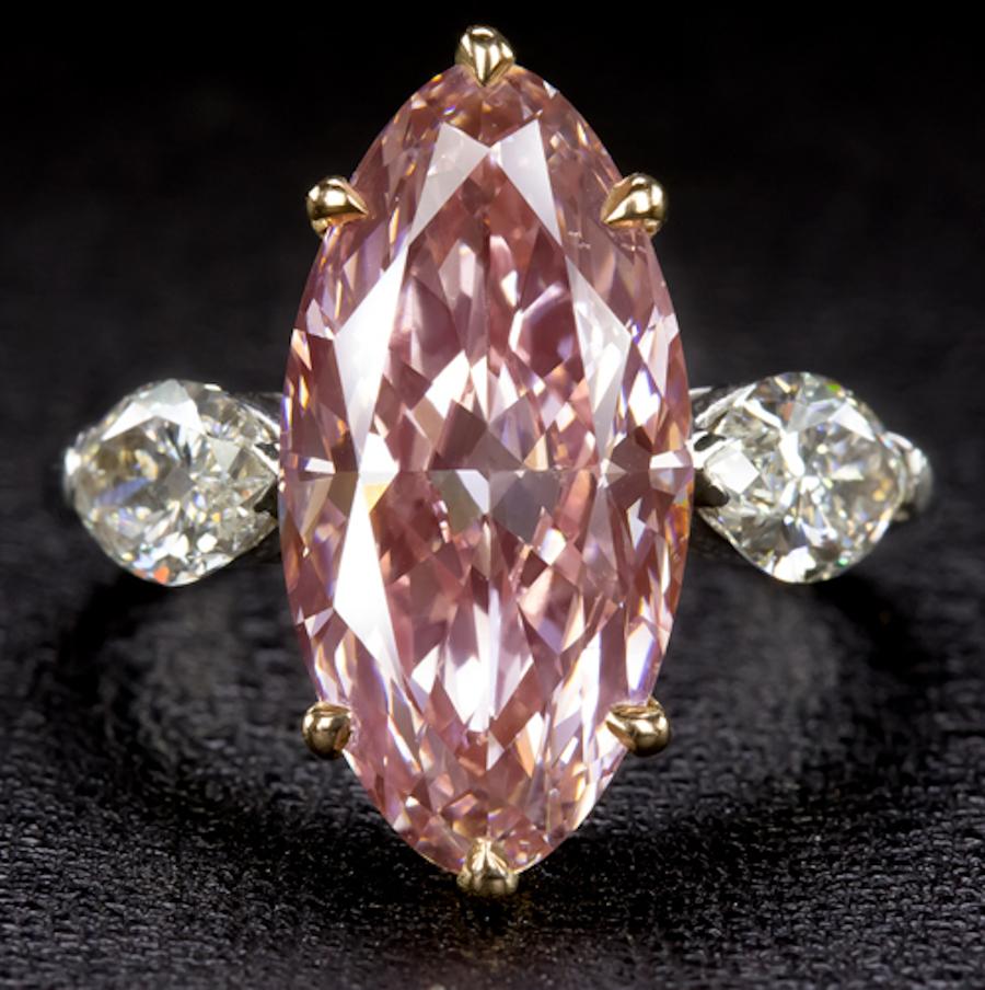 Featured here is a one of a kind, show stopping ring with a 5.32ct fancy intense pink diamond that has been certified by GIA! The color of this diamond is truly something special and a rare sight to see, especially in this very generous 5ct+ size