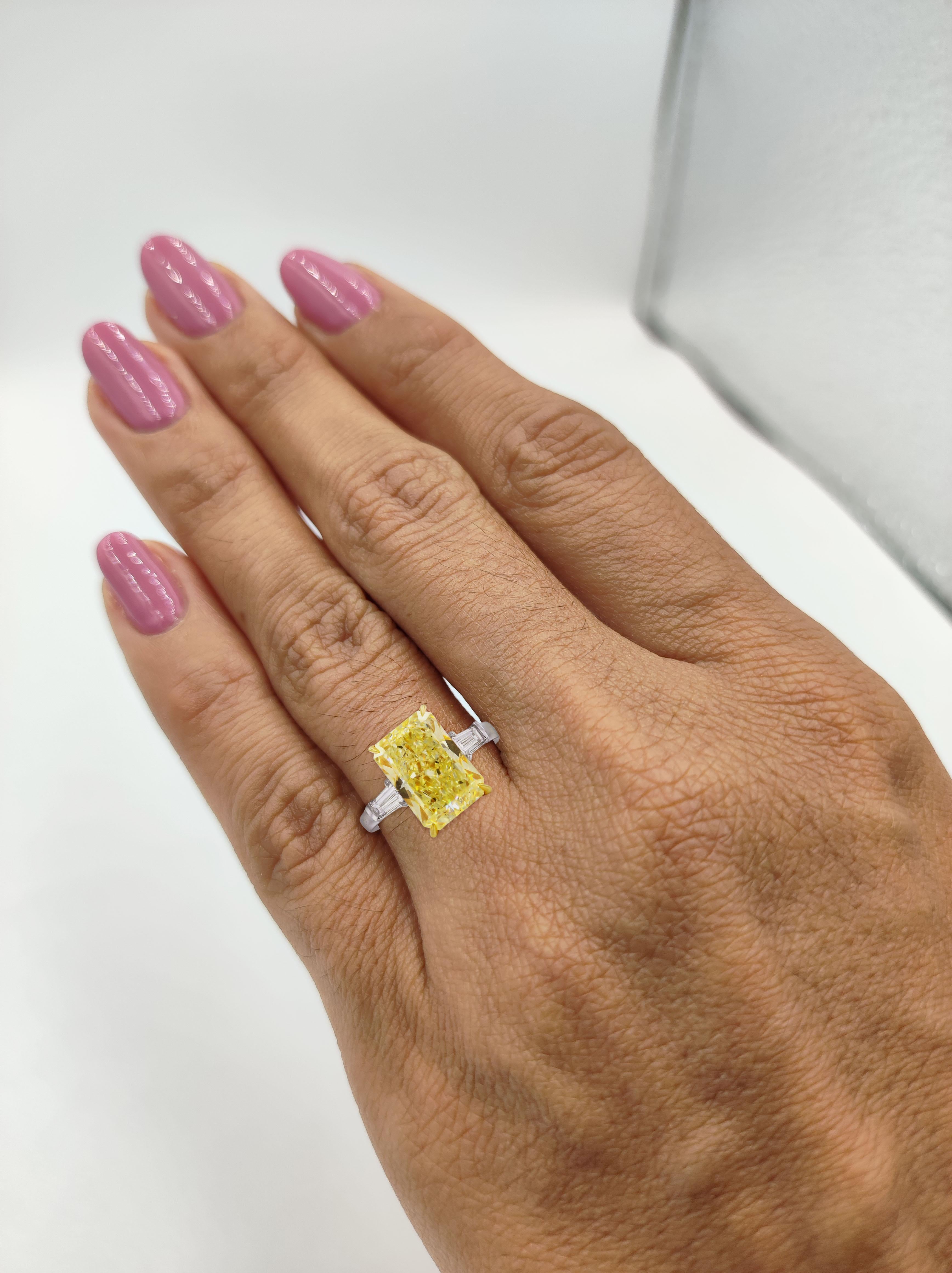 Magnificent radiant cut diamond ring is the Highlight of Antinori di Sanpietro ROMA Speechless 5 Carats Fancy Yellow Radiant Cut, Internally Flawless in clarity. Certified by GIA set with 1 Carats of two beautiful tapered baguette diamonds set in