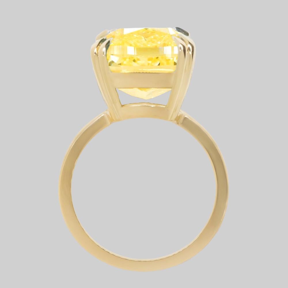 Contemporary GIA Certified 5.01 Carat Cushion Fancy Intense Yellow Diamond Solitaire Ring For Sale