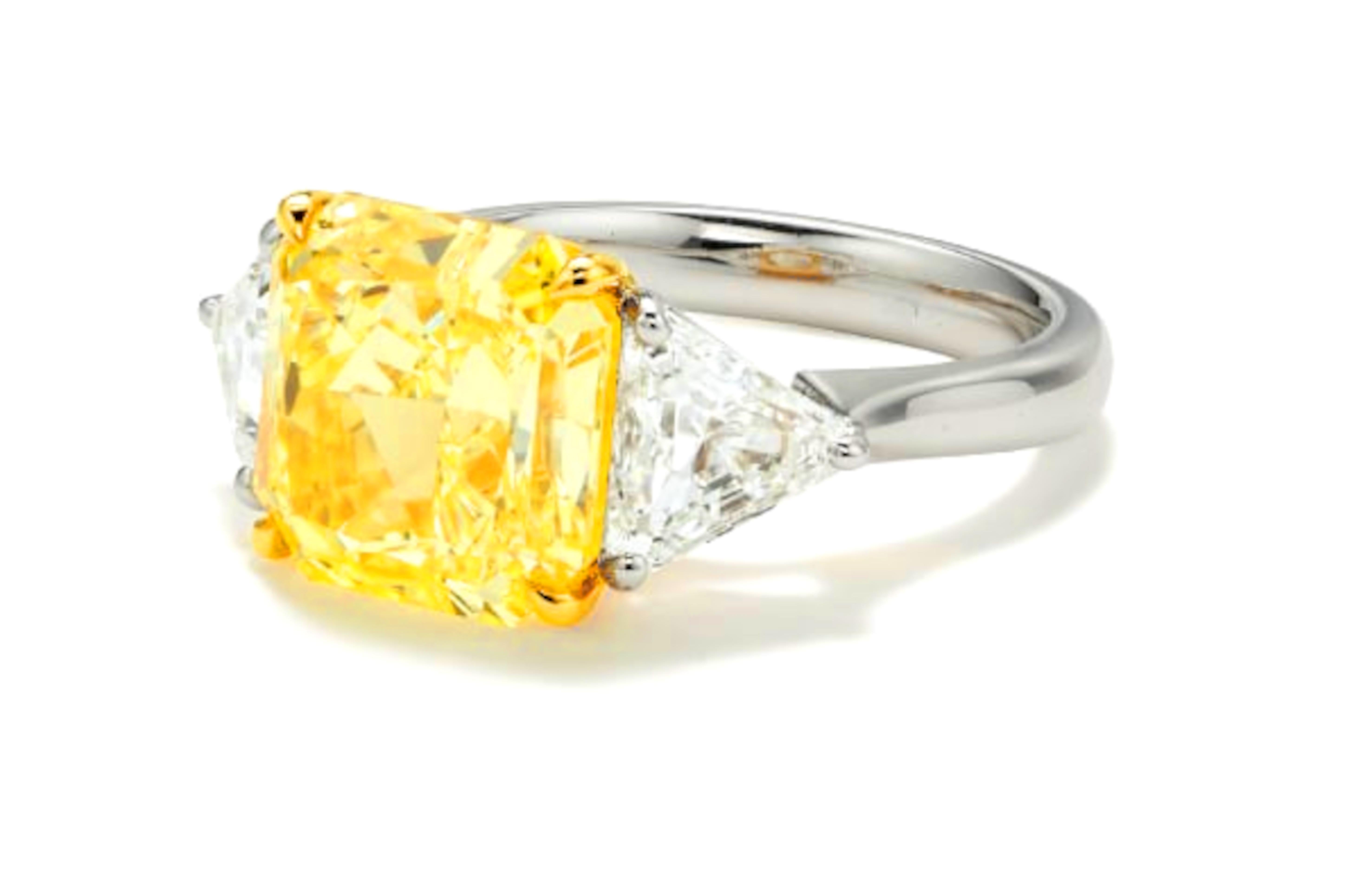 💛 RADIANT ELEGANCE: 5.00 Carat GIA-Certified Fancy Yellow Diamond Ring 💛

A striking masterpiece, this 5.00-carat GIA-certified Fancy Yellow radiant-cut diamond captivates with its intense golden hue and exceptional VS2 clarity—a testament to its