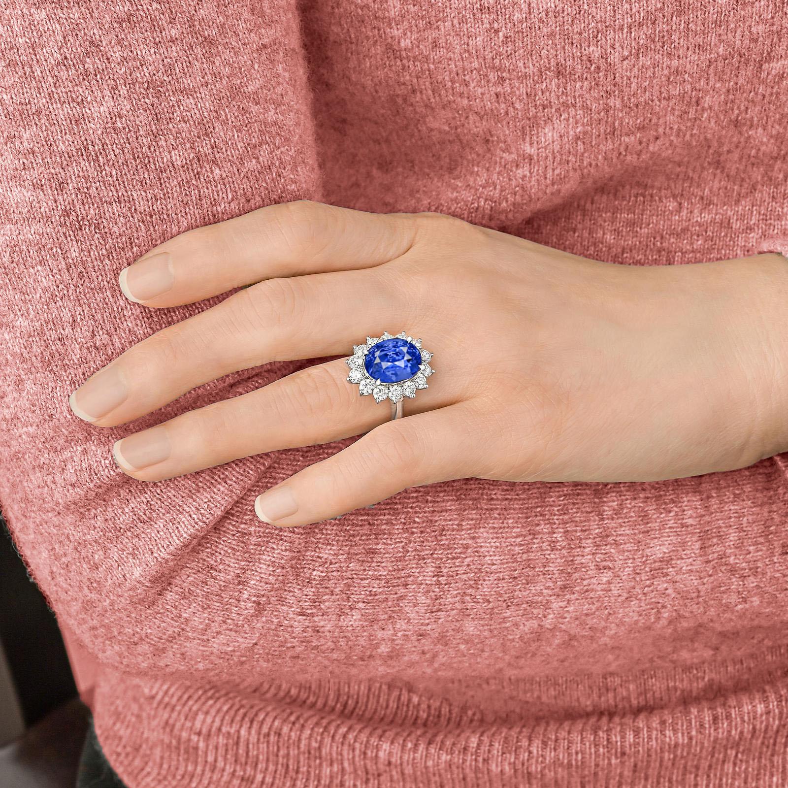 Introducing a truly extraordinary piece of fine jewelry: the GIA Certified 5 Carat Intense BURMESE Blue No Heat Sapphire Diamond Ring.

Immerse yourself in the captivating allure of this exquisite ring, featuring a stunning 5 carat Burmese Blue No
