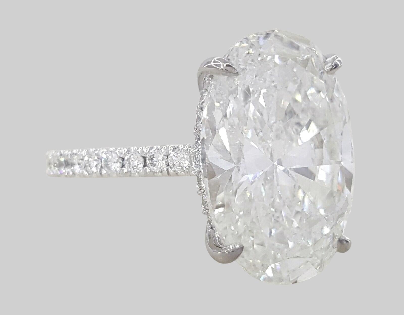 Contemporary GIA Certified 5.02 Carat Oval Cut Diamond IF Clarity Ring in 18K White Gold For Sale