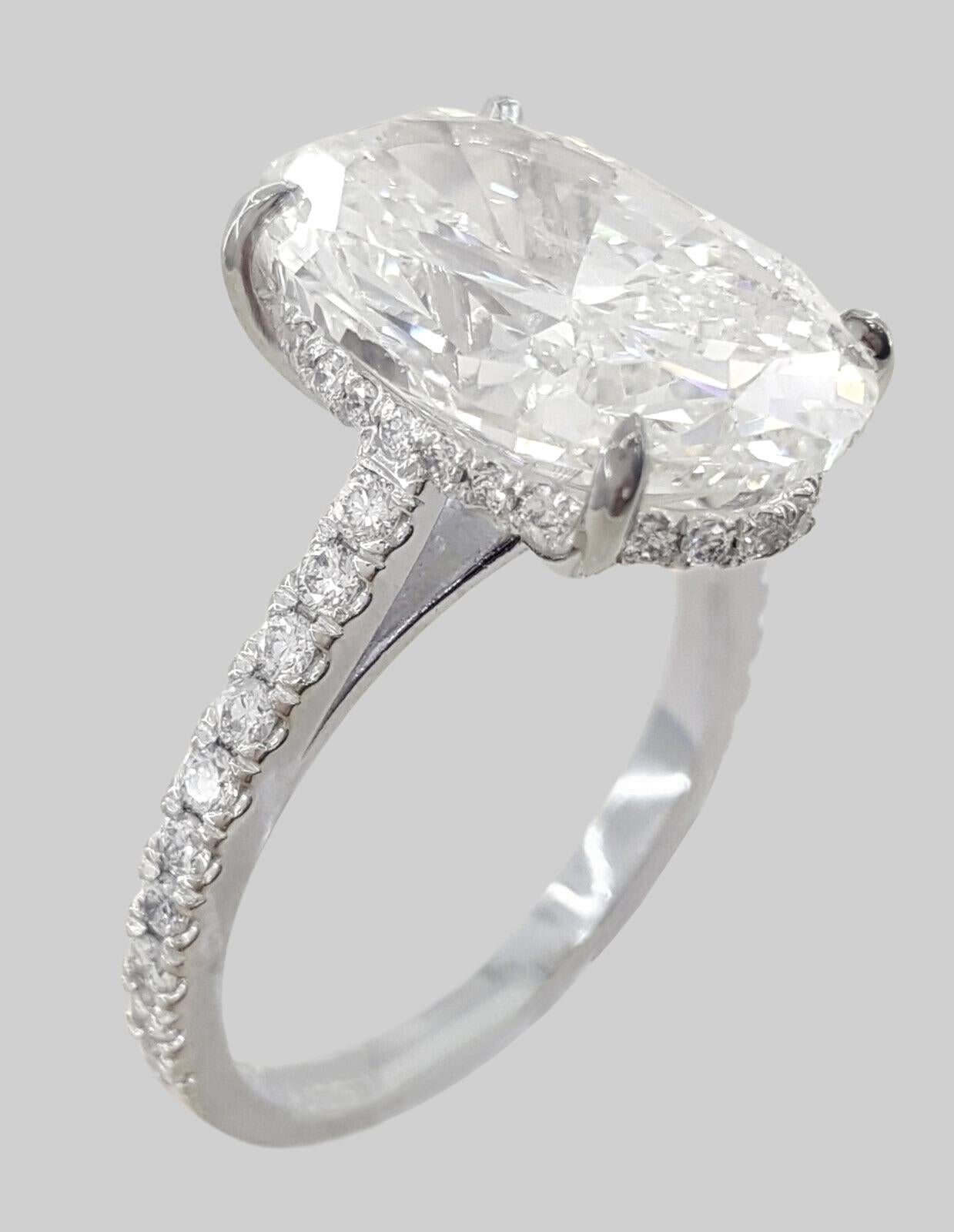 GIA Certified 5.02 Carat Oval Cut Diamond IF Clarity Ring in 18K White Gold In New Condition For Sale In Chicago, IL