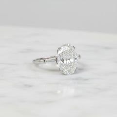 GIA Certified 5 Carat Oval Cut Diamond Ring in Platinum with tapered baguette