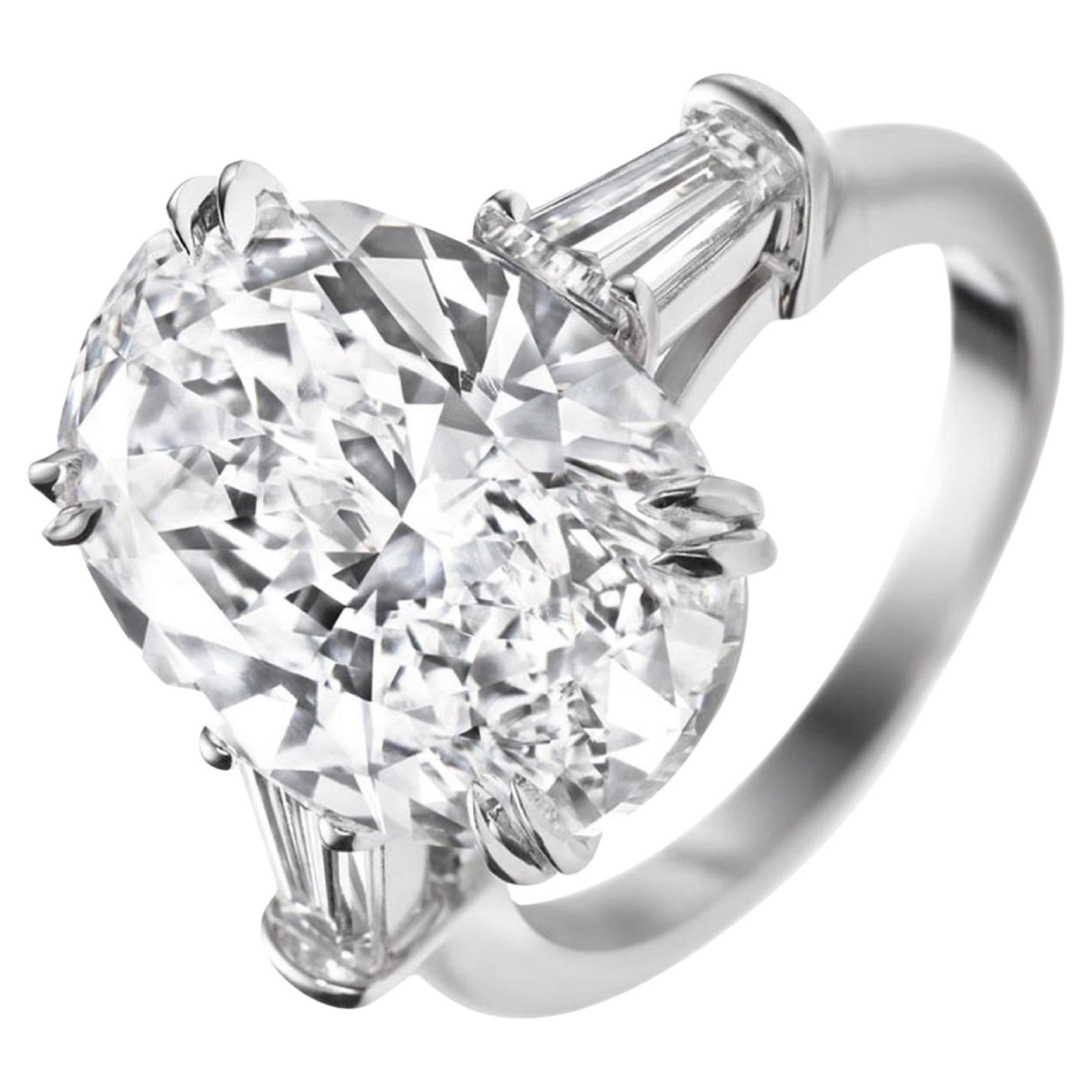 GIA Certified 5.01 Carat Oval Diamond Engagement Ring with tapered baguette