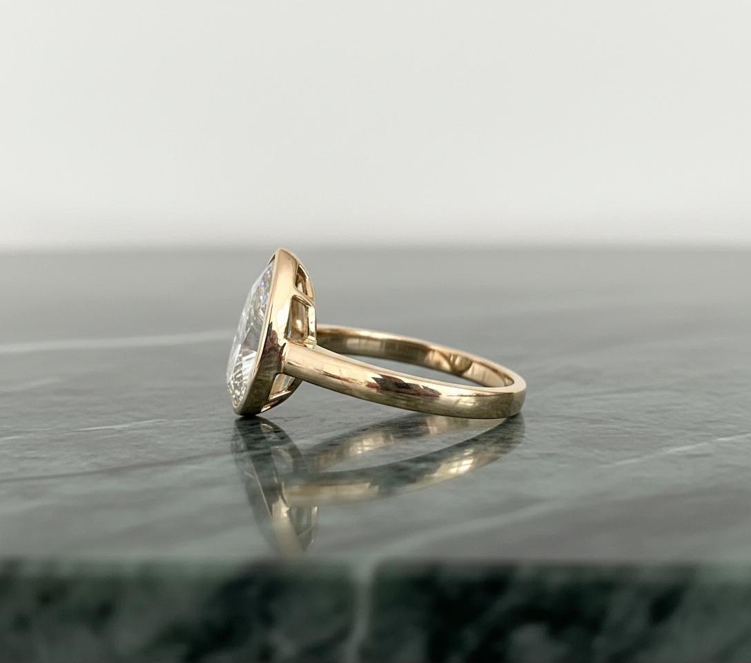 Art Deco GIA Certified 5 Carat Pear Brilliant Cut Diamond Bezel Set Ring For Sale