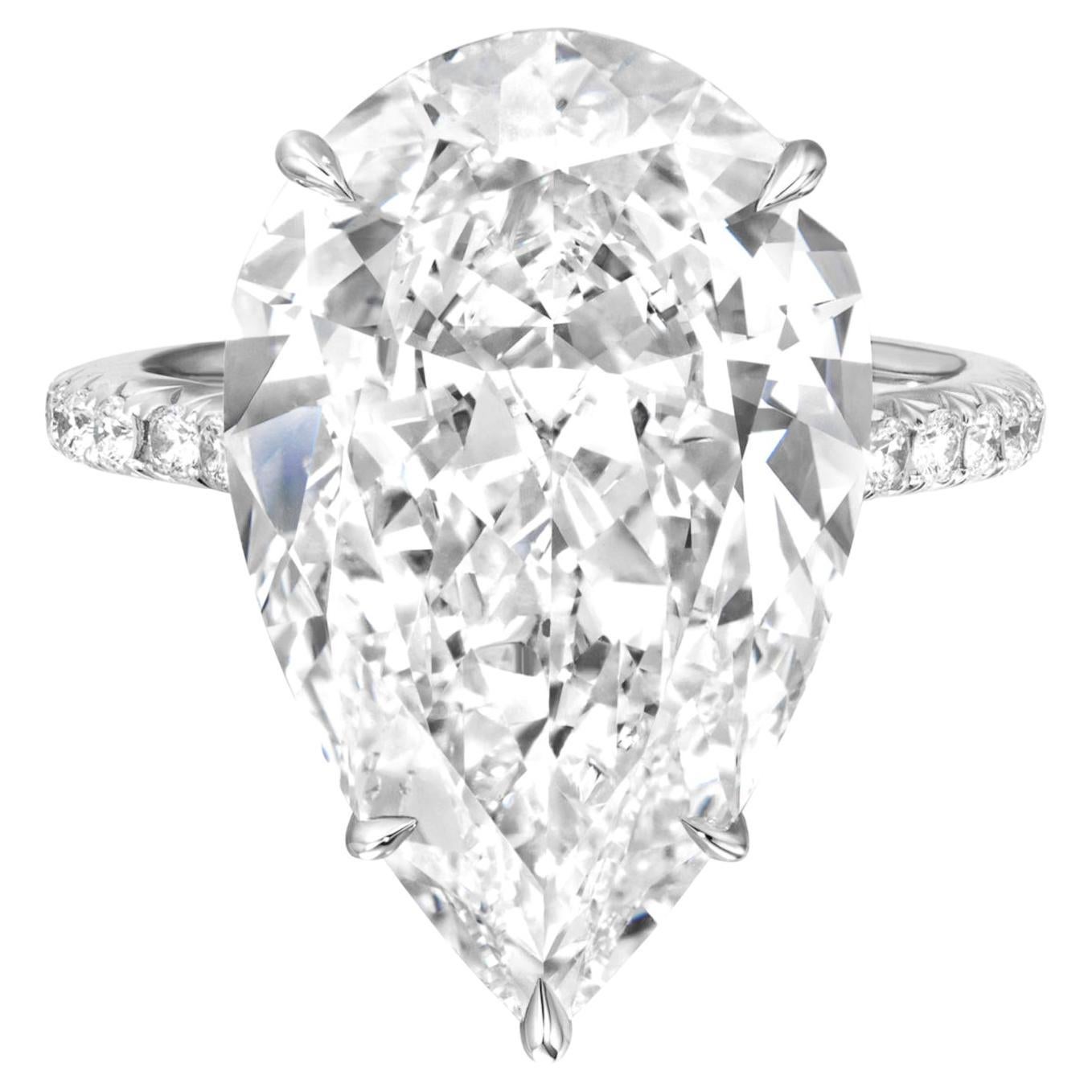 This luxurious ring features an exquisite 5.50 carat pear-cut diamond, certified by GIA for its superb quality, set in a refined platinum mounting.

With an E color grade, the diamond offers a pristine, near-colorless sparkle that exudes