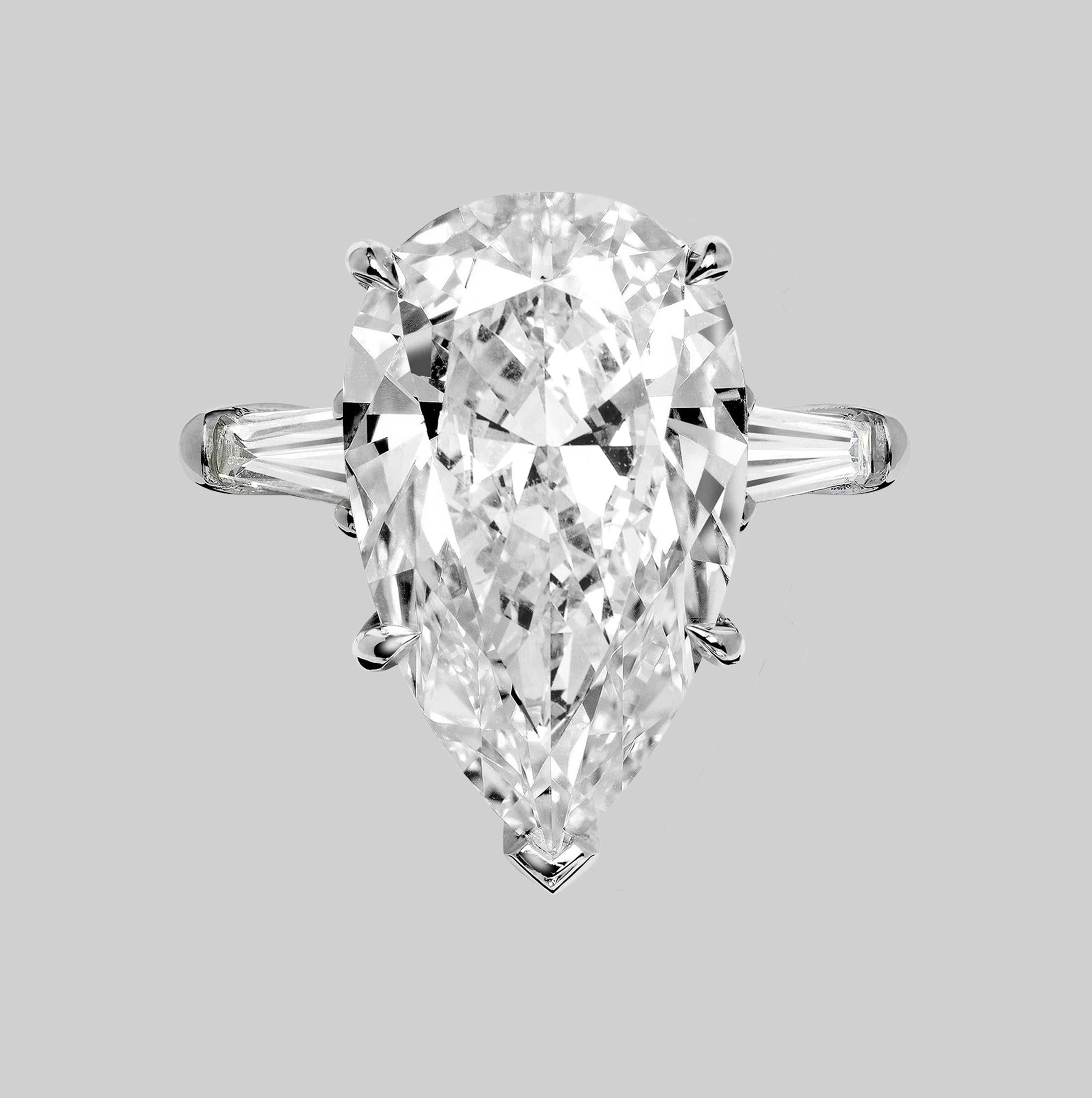 Modern GIA Certified 5 Carat Pear Cut Diamond Three Stone Ring For Sale