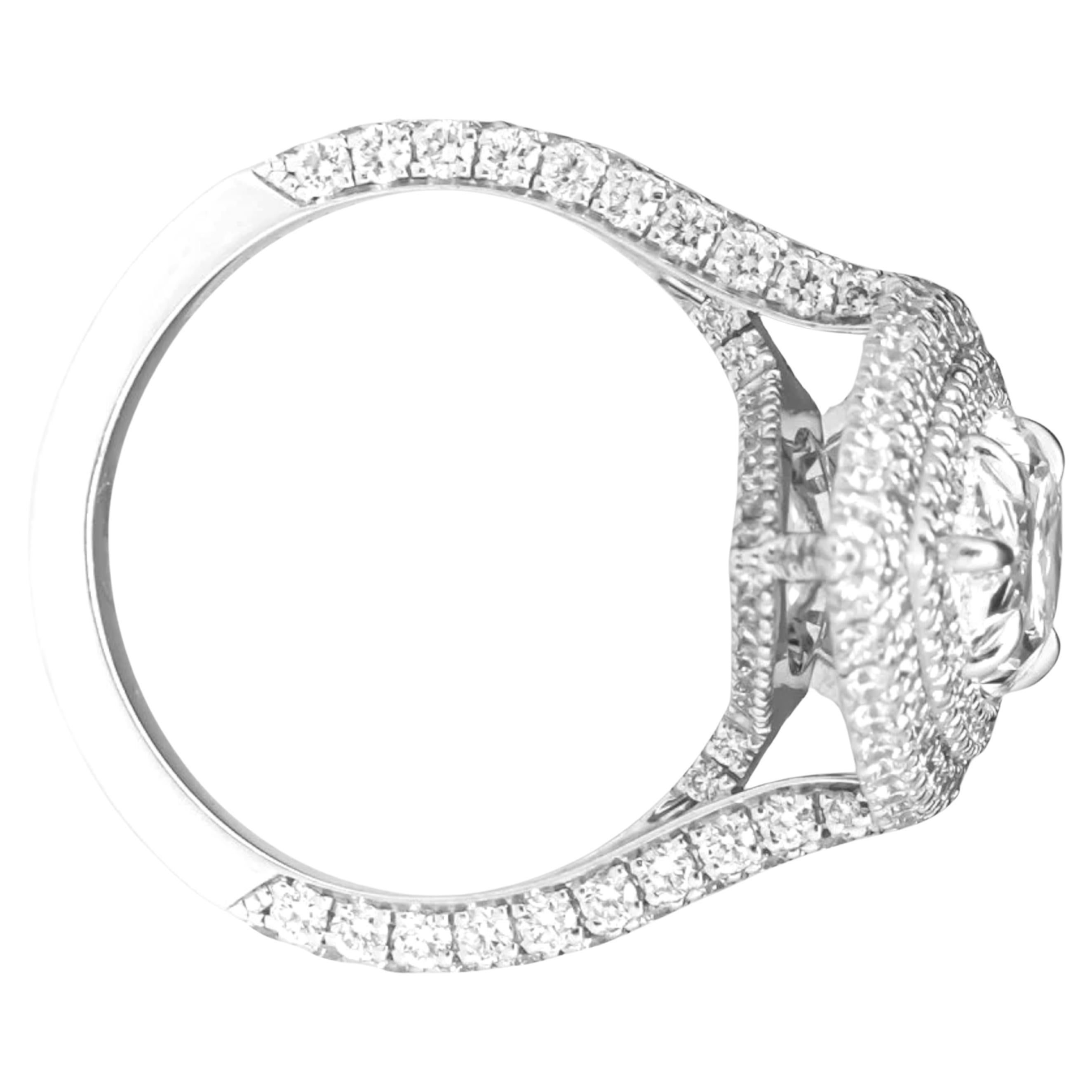 This extraordinary cocktail ring features a breathtaking GIA-certified 5.01 carat pear cut diamond, set in a timeless platinum mounting with a double halo of round brilliant cut diamonds. The center stone boasts an exceptional E color and FLAWLESS