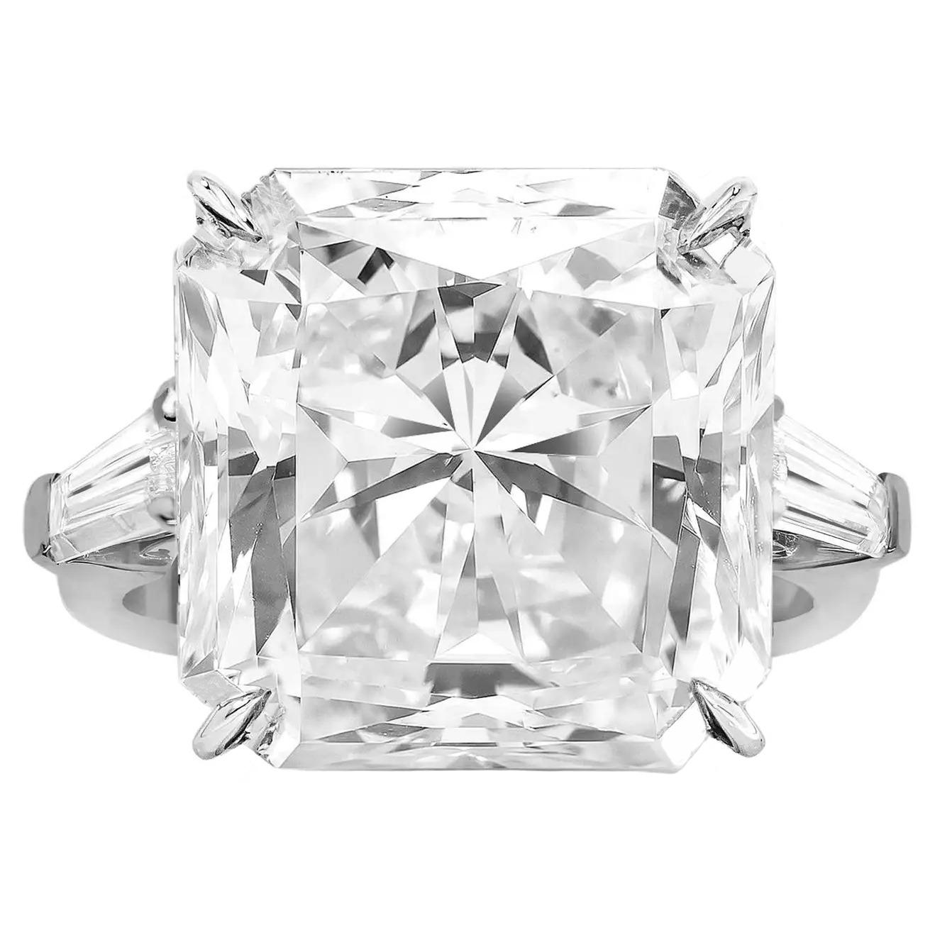 This striking ring features a radiant-cut diamond certified by the Gemological Institute of America (GIA). The diamond, with an impressive weight of 5.03 carats, showcases a captivating F color grade, indicating a near-colorless and highly desirable