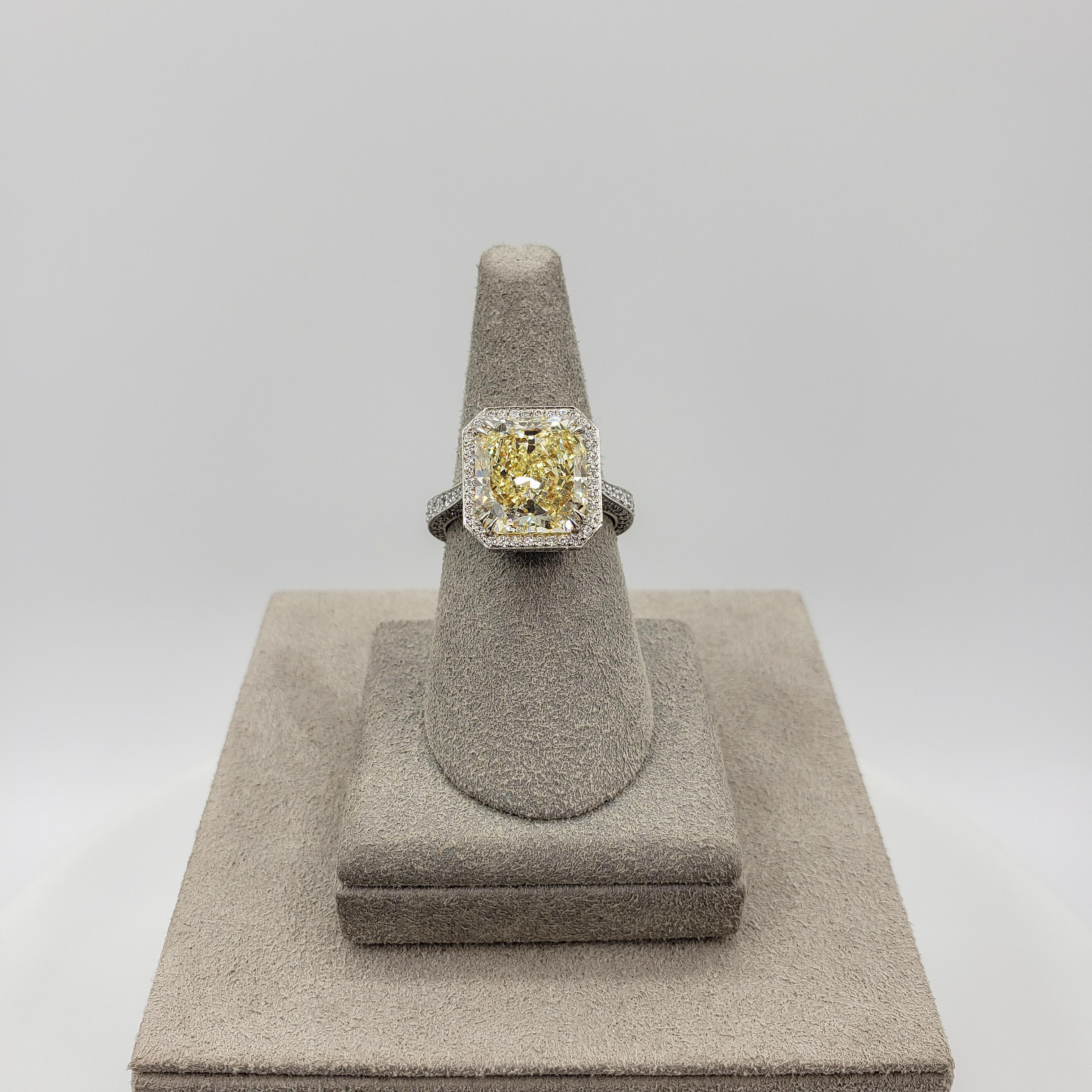 Women's GIA Certified 5.27 Carats Radiant Cut Yellow Diamond Halo Engagement Ring For Sale