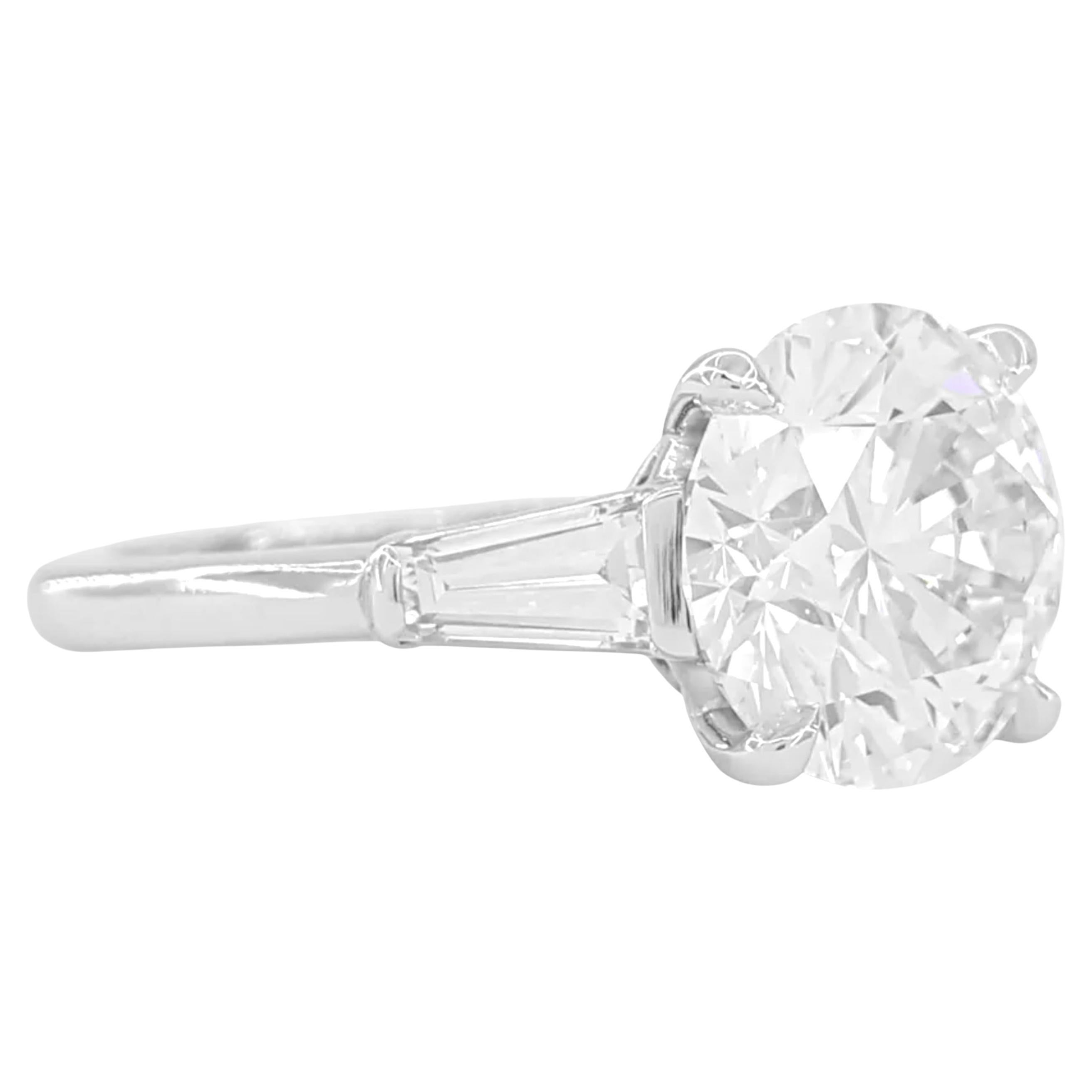 Contemporary GIA Certified 5 Carat Round Brilliant Cut Diamond Ring with tapered baguette For Sale