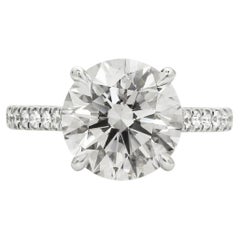 GIA Certified 5.03 Carat Round Cut Diamond Ring with pavè in 18K White Gold