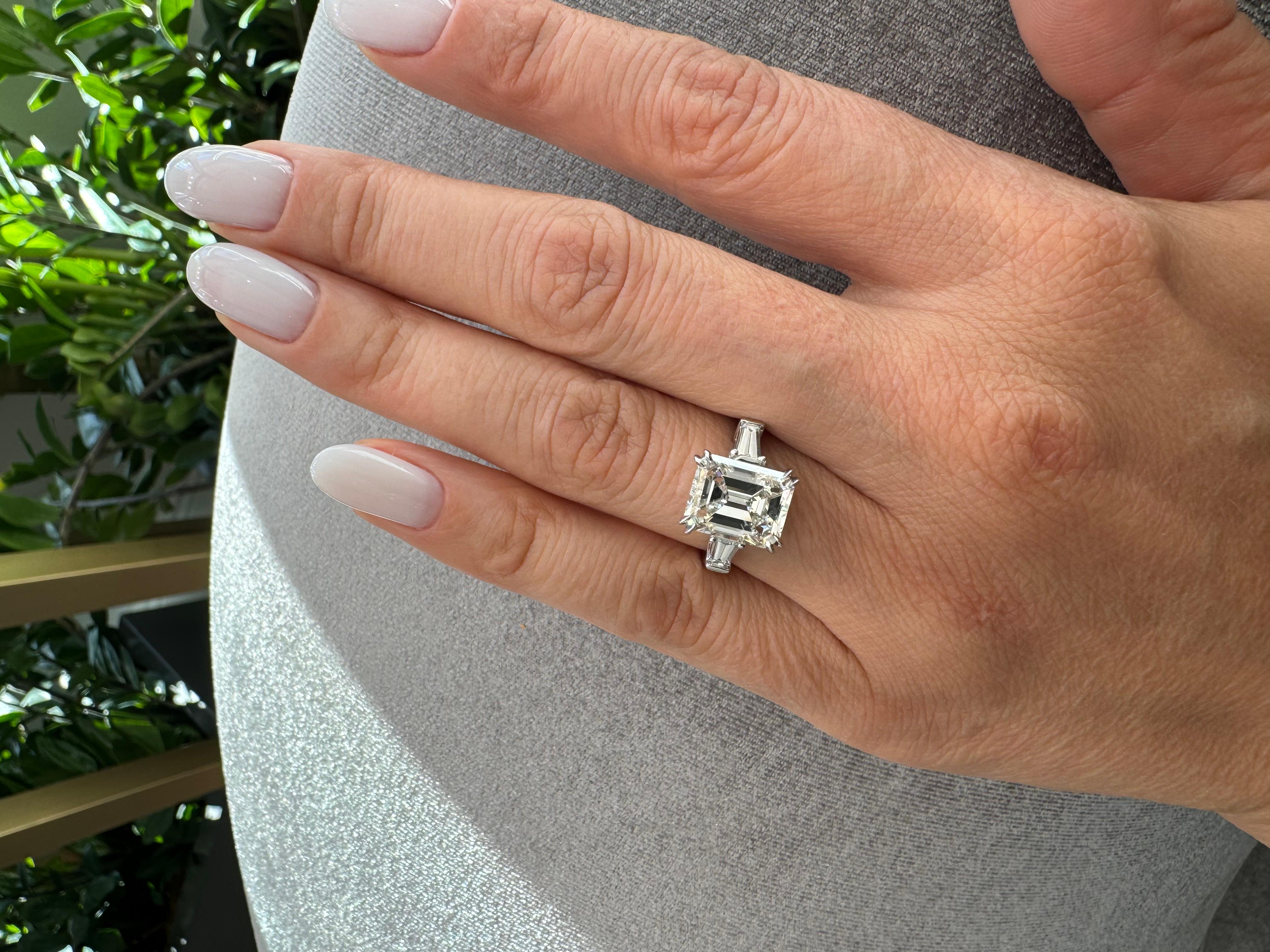 GIA Certified 5 Carat TW Emerald Cut Diamond Three Stone Platinum Ring In New Condition For Sale In Miami, FL